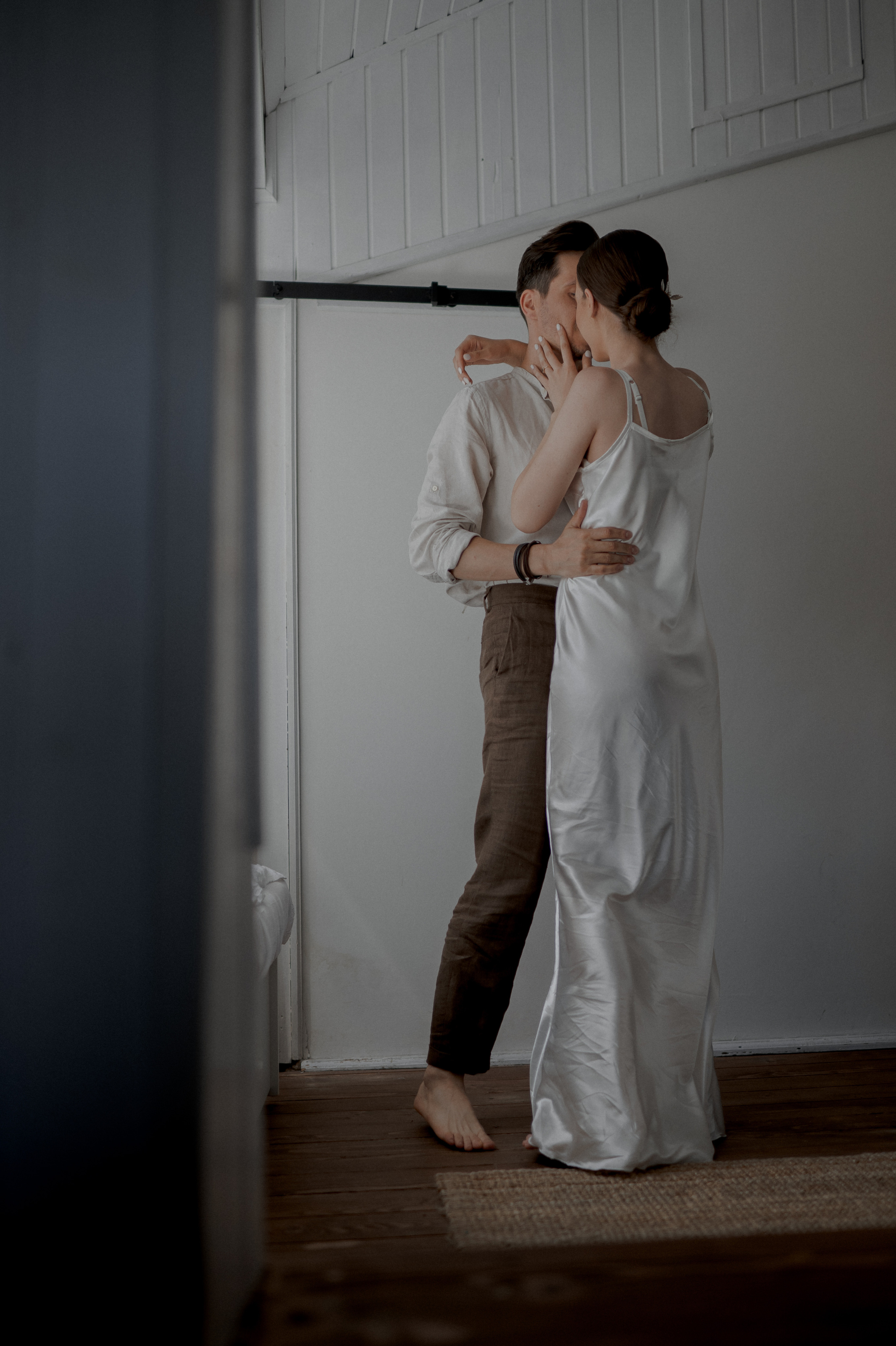 In a celebration of love, the couple finds themselves dancing in the room, their spirits intertwined as they create cherished memories amidst the joyful rhythm of their wedding day.