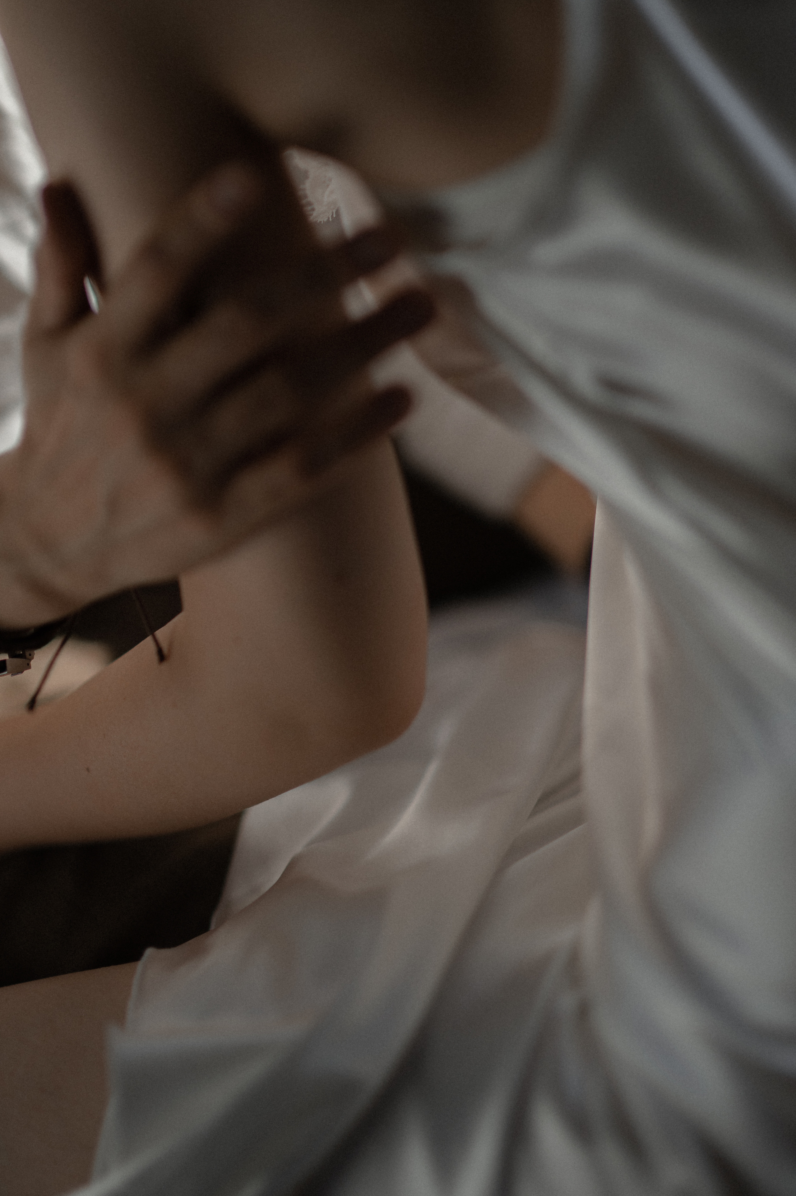 With hands gently caressing, the couple leans in for a heartfelt kiss, every touch and intricate detail accentuating the depth of their love within the intimate room.