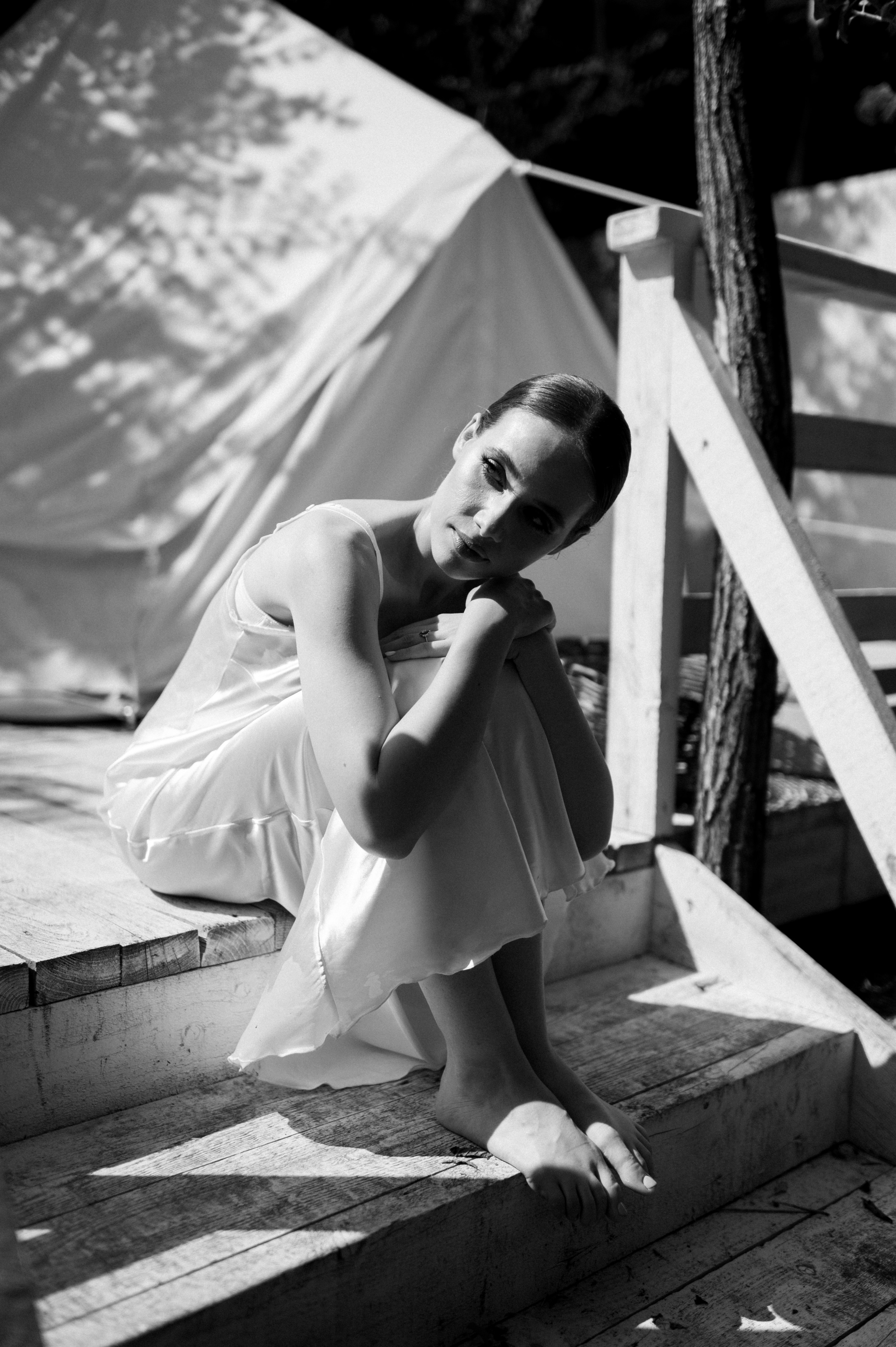 As the wedding morning unfolds, the delicate bride's satin dress becomes a symbol of her inner radiance and pure joy.