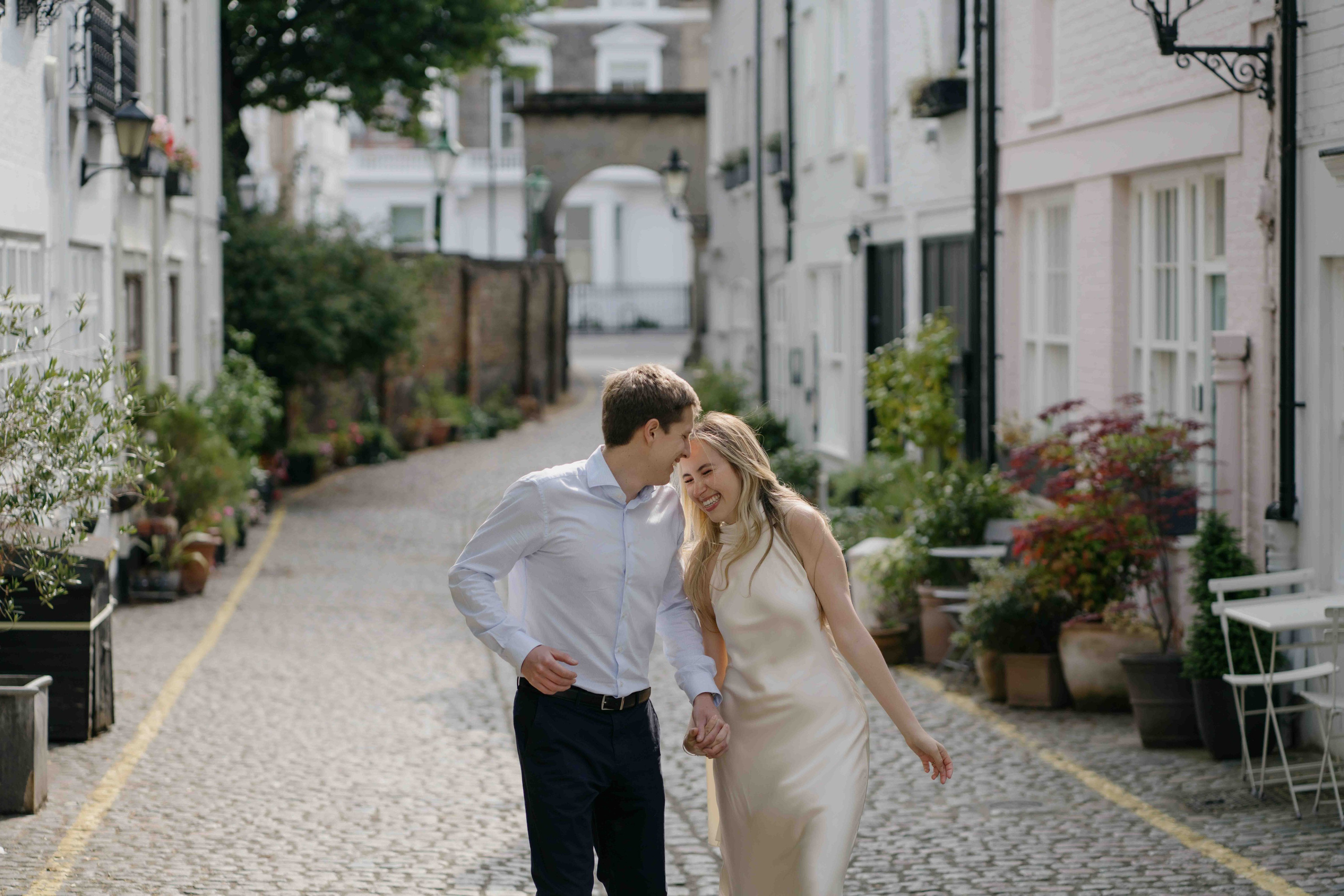 Romantic engagement photoshoot in a charming London cobblestone street