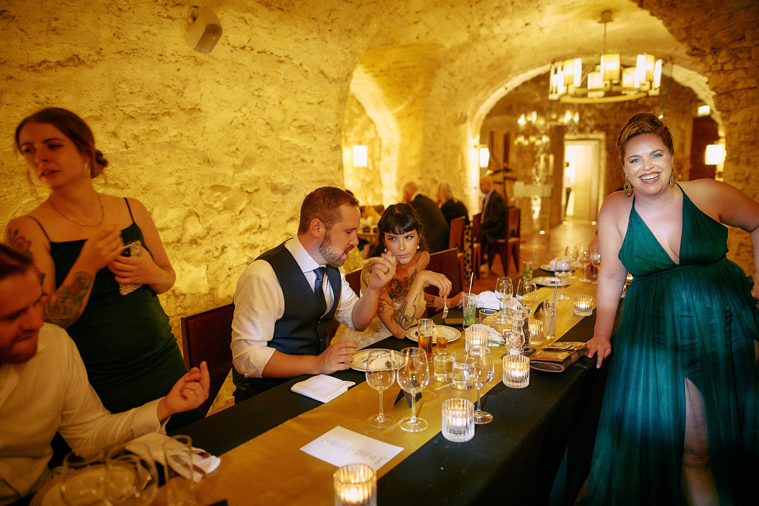 Tattooed bride reacting surprised to incoming round of shots.