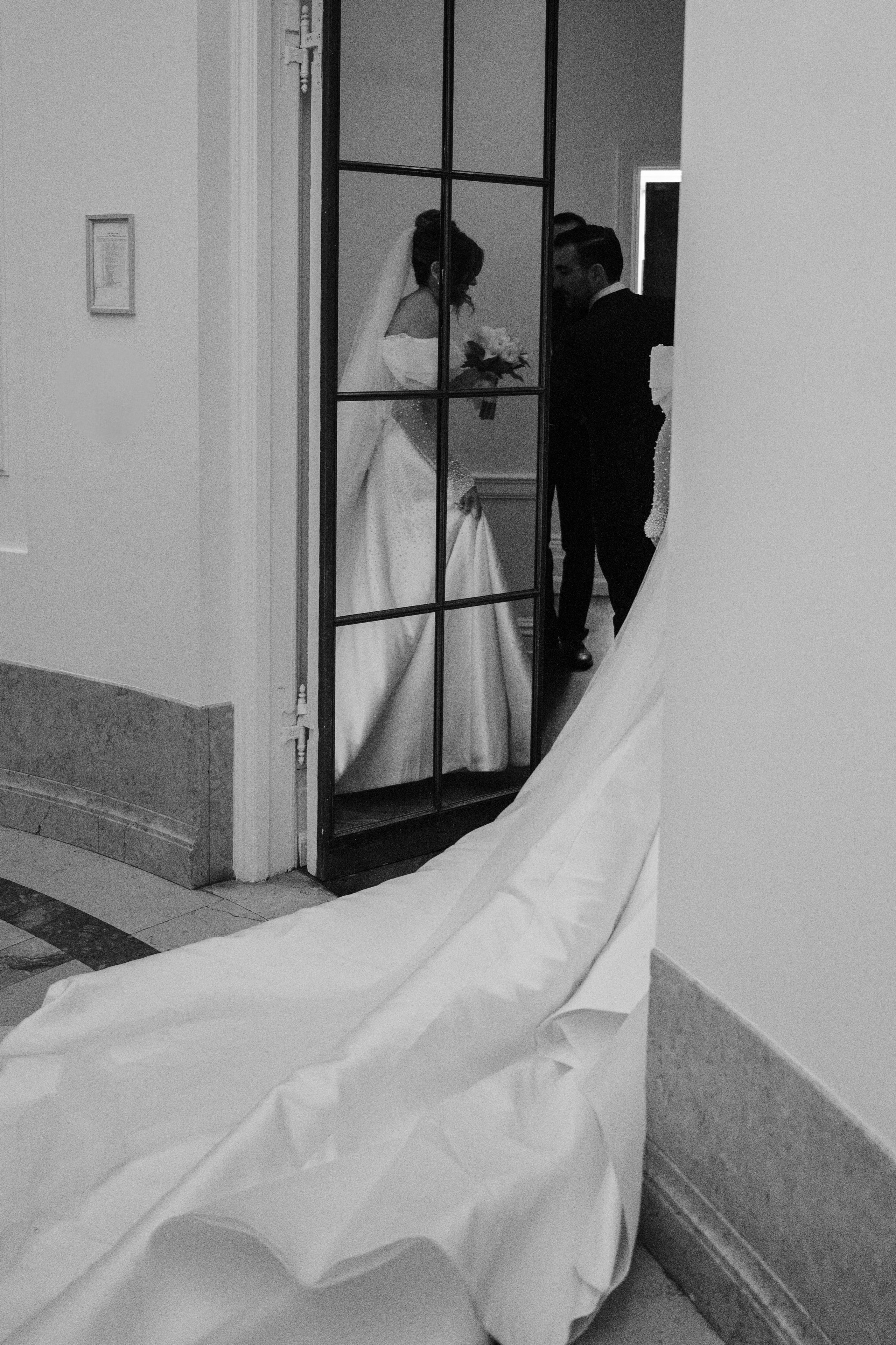 a bride is getting ready to walk down the aisle