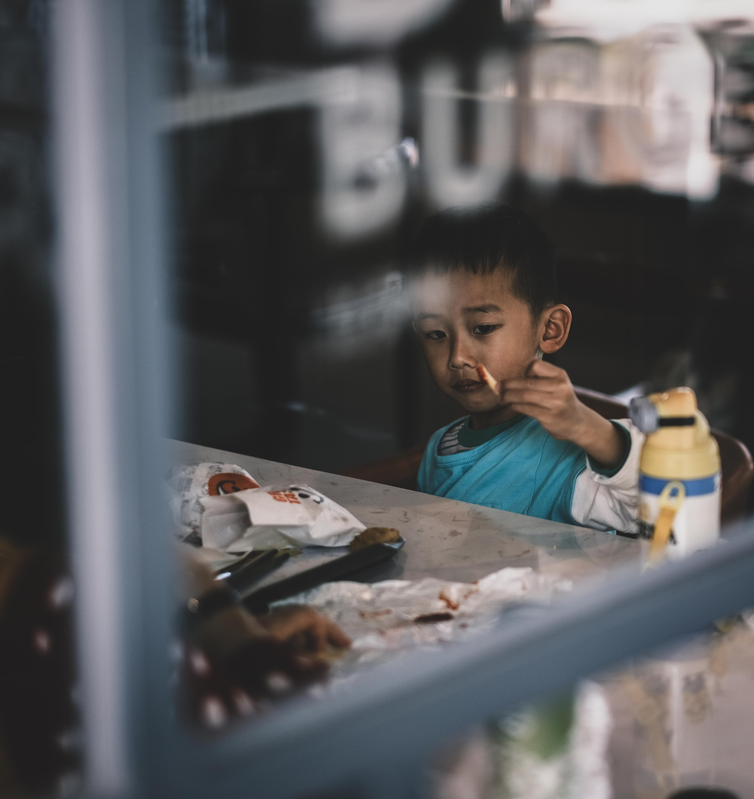 A boy | Fast Food Restaurant | Guangdong Province | Dongguan City | China | 一个男孩 | 快餐店| 广东省| 东莞市| 中国