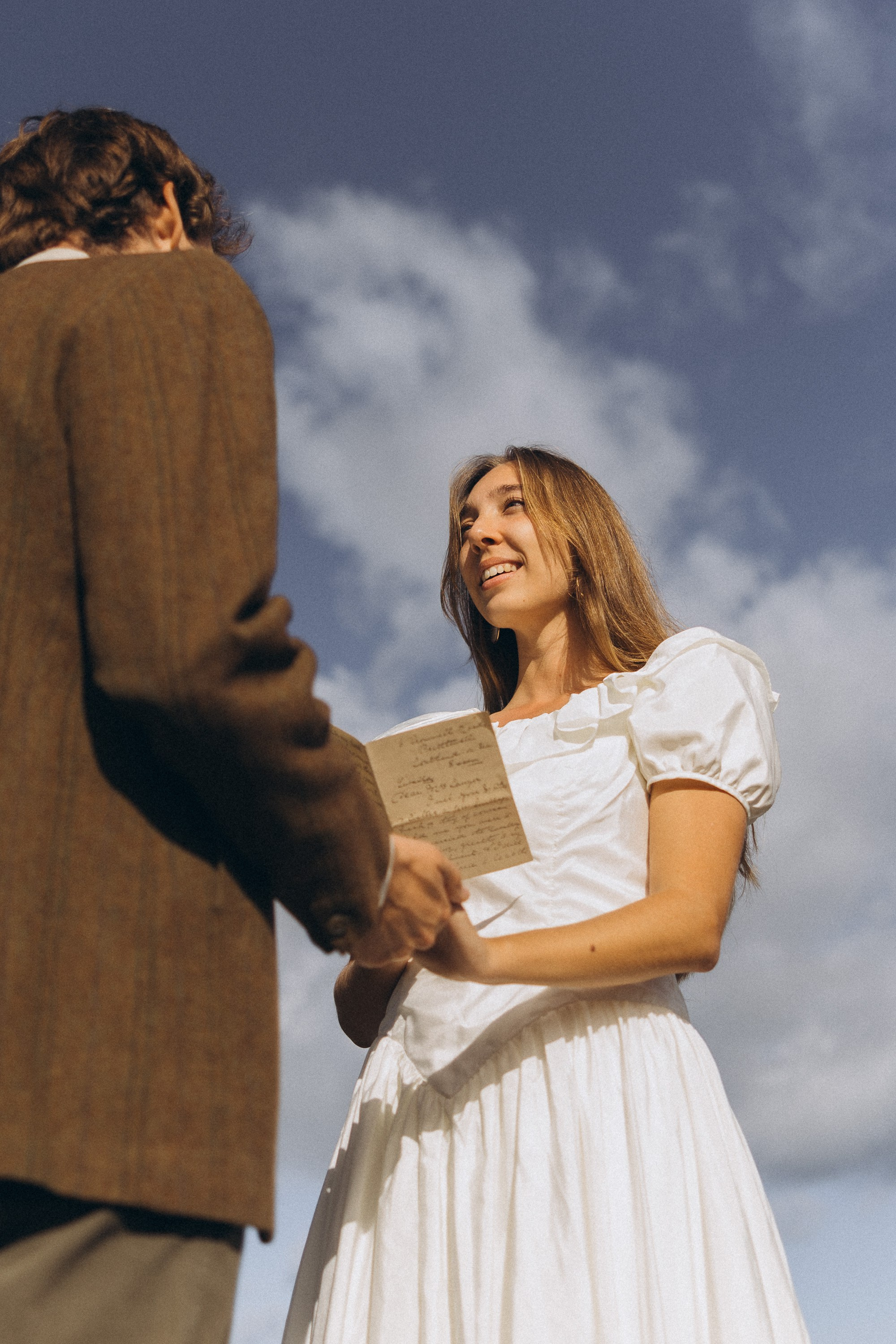 Romantic elopement in Madeira — couple exchanging vows with Atlantic Ocean views.