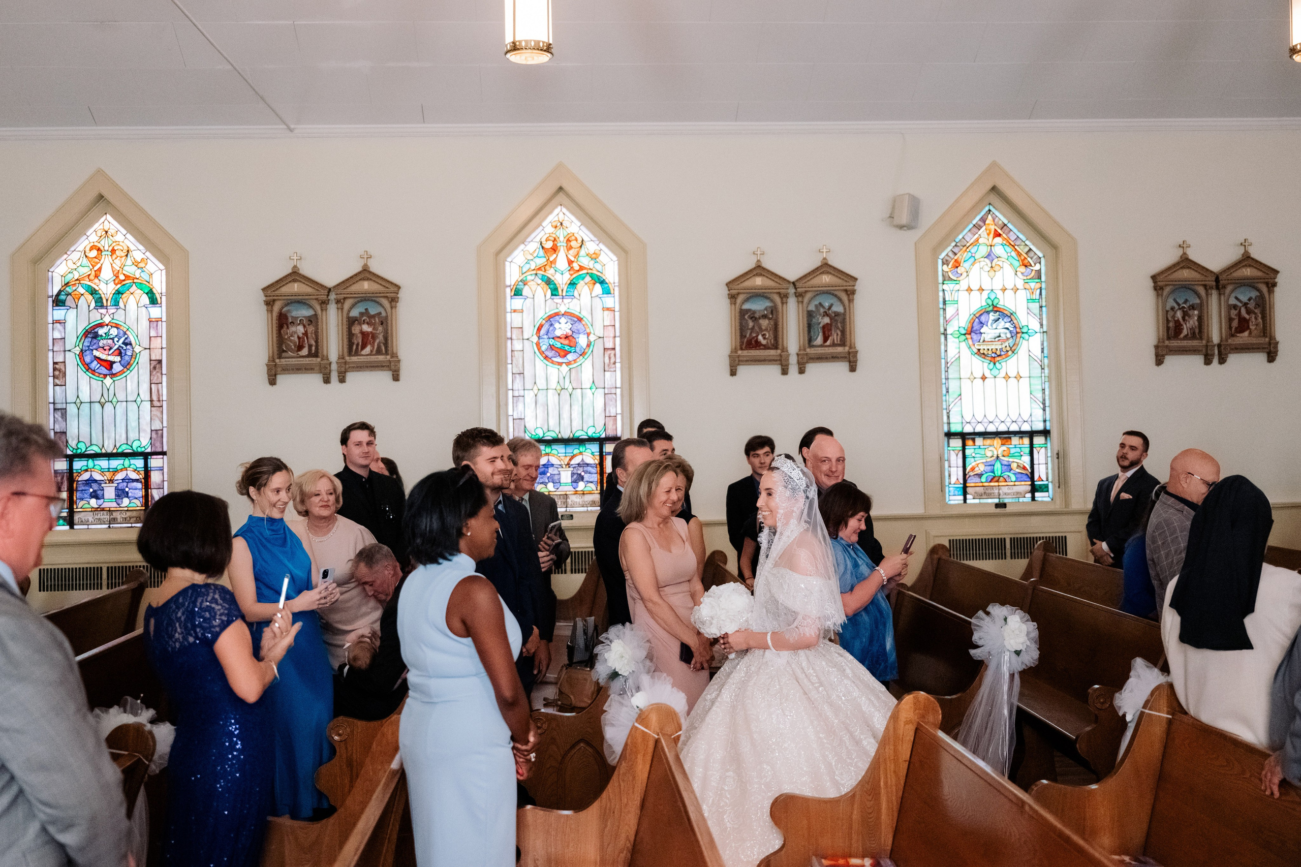 a bride and groom are walking down the aisle