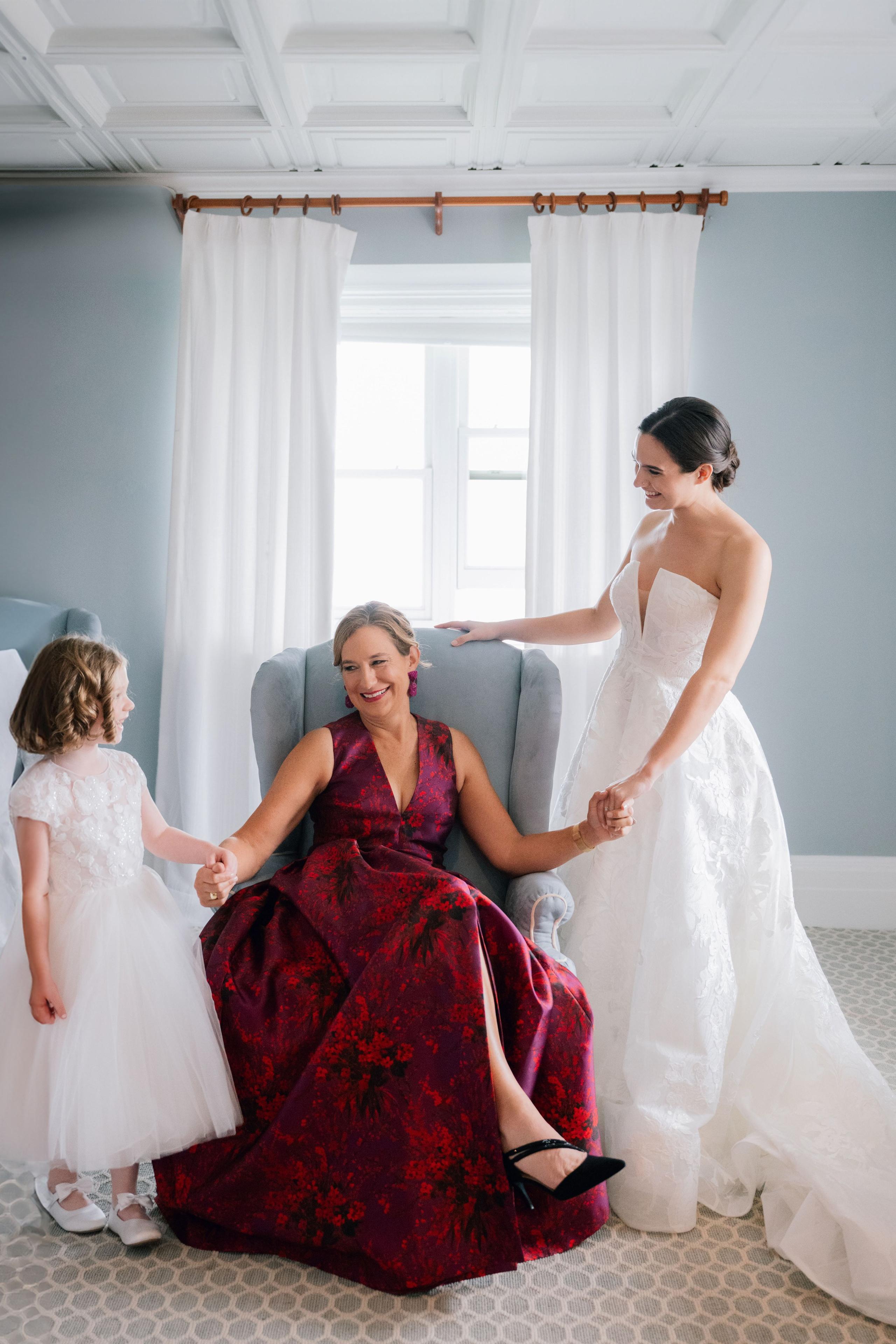 a bride and her flower girl getting ready for their wedding