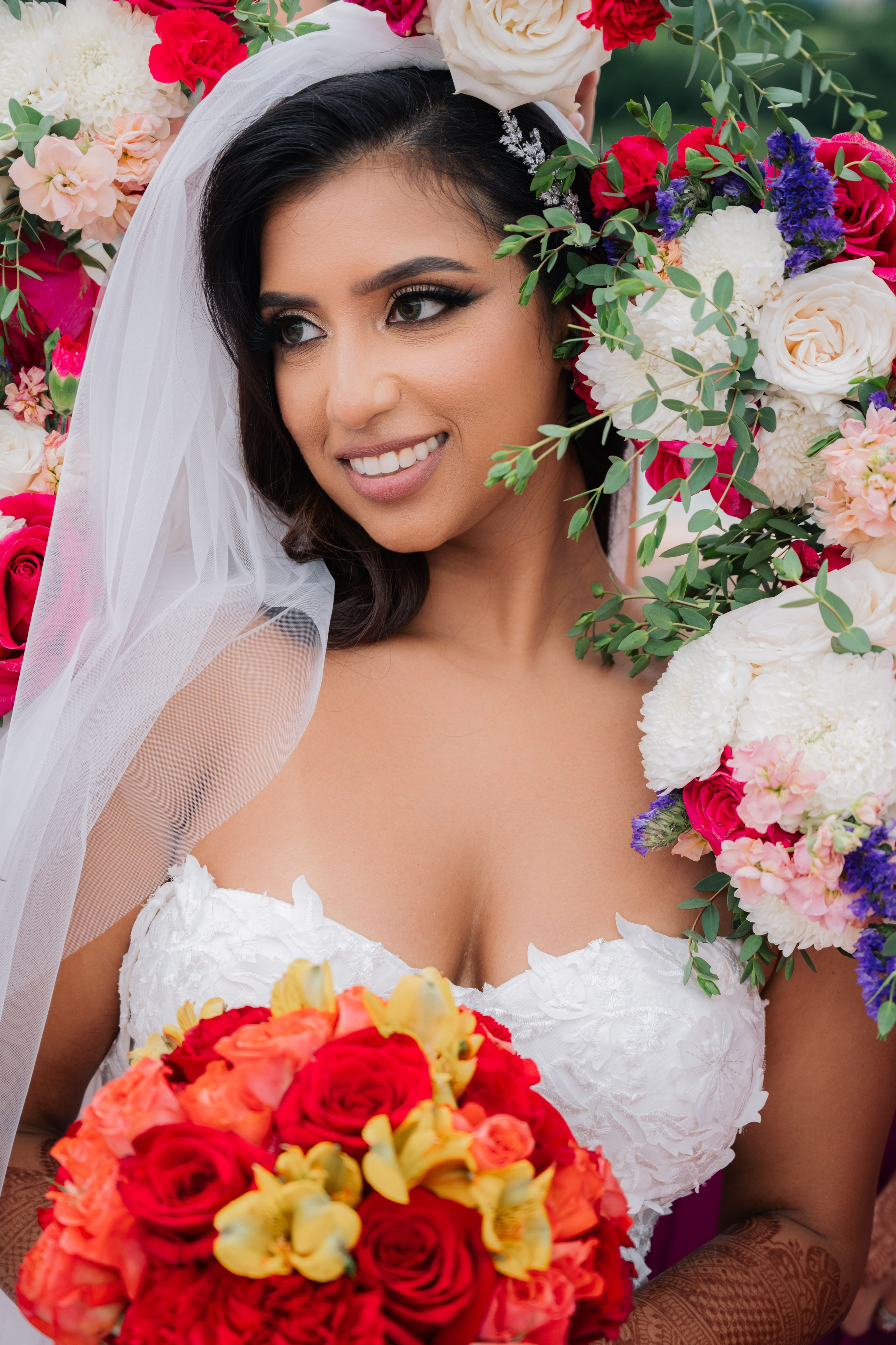a bride with a bouquet of flowers in her hair