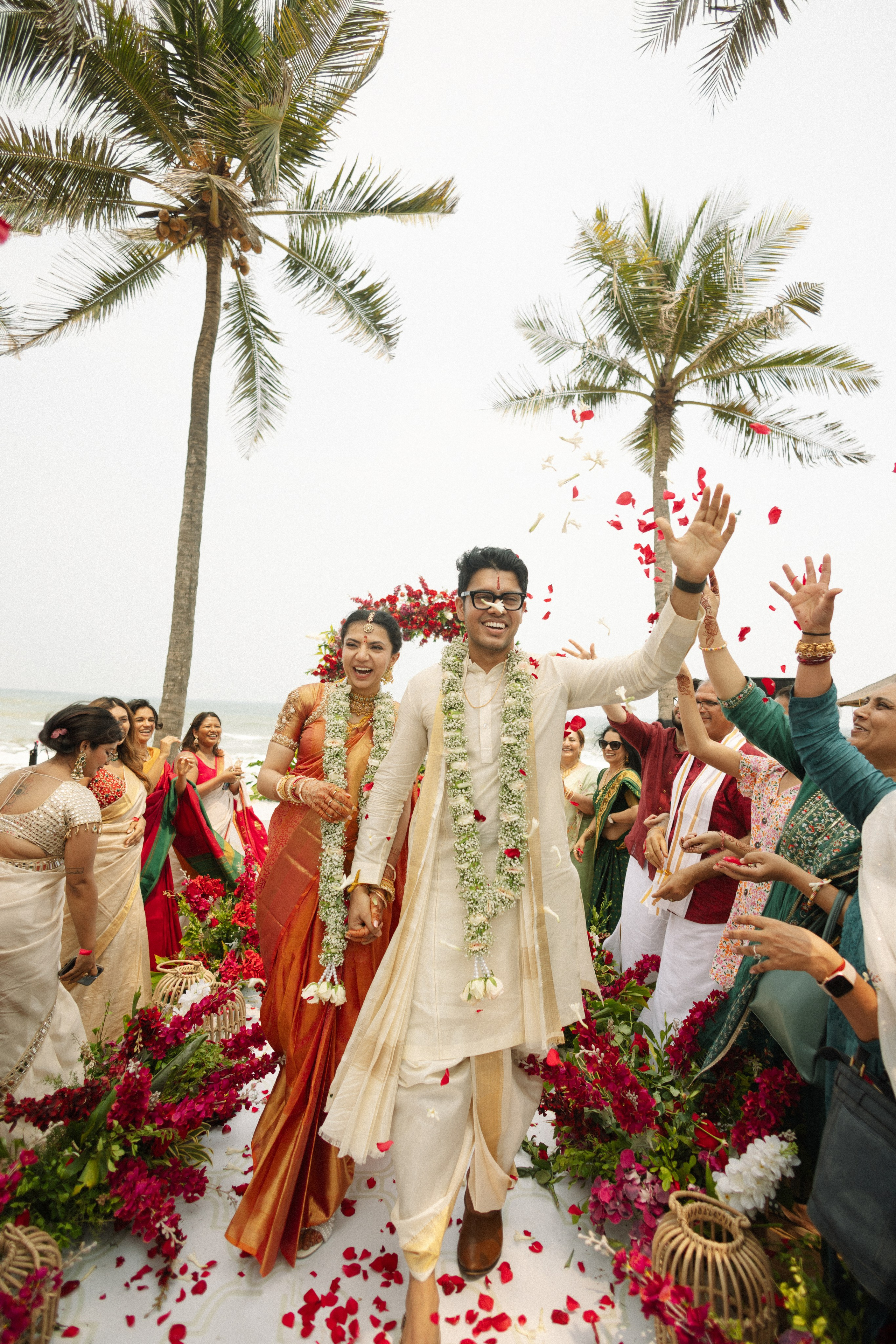Bride and groom walking on grass at outdoor wedding ceremony