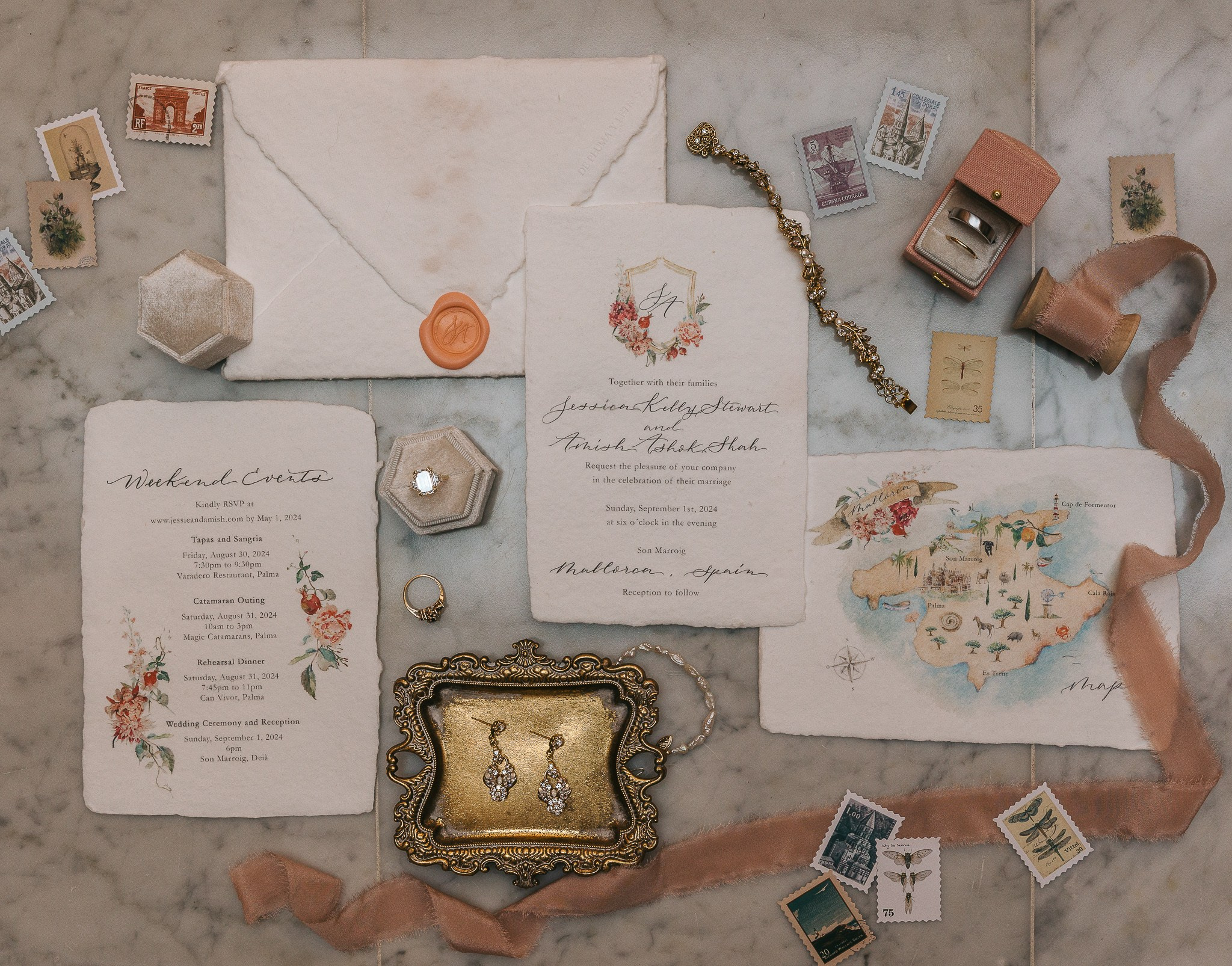 Wedding invitation suite flat lay with rings and jewelry for Jessie and Amish's Son Marroig wedding