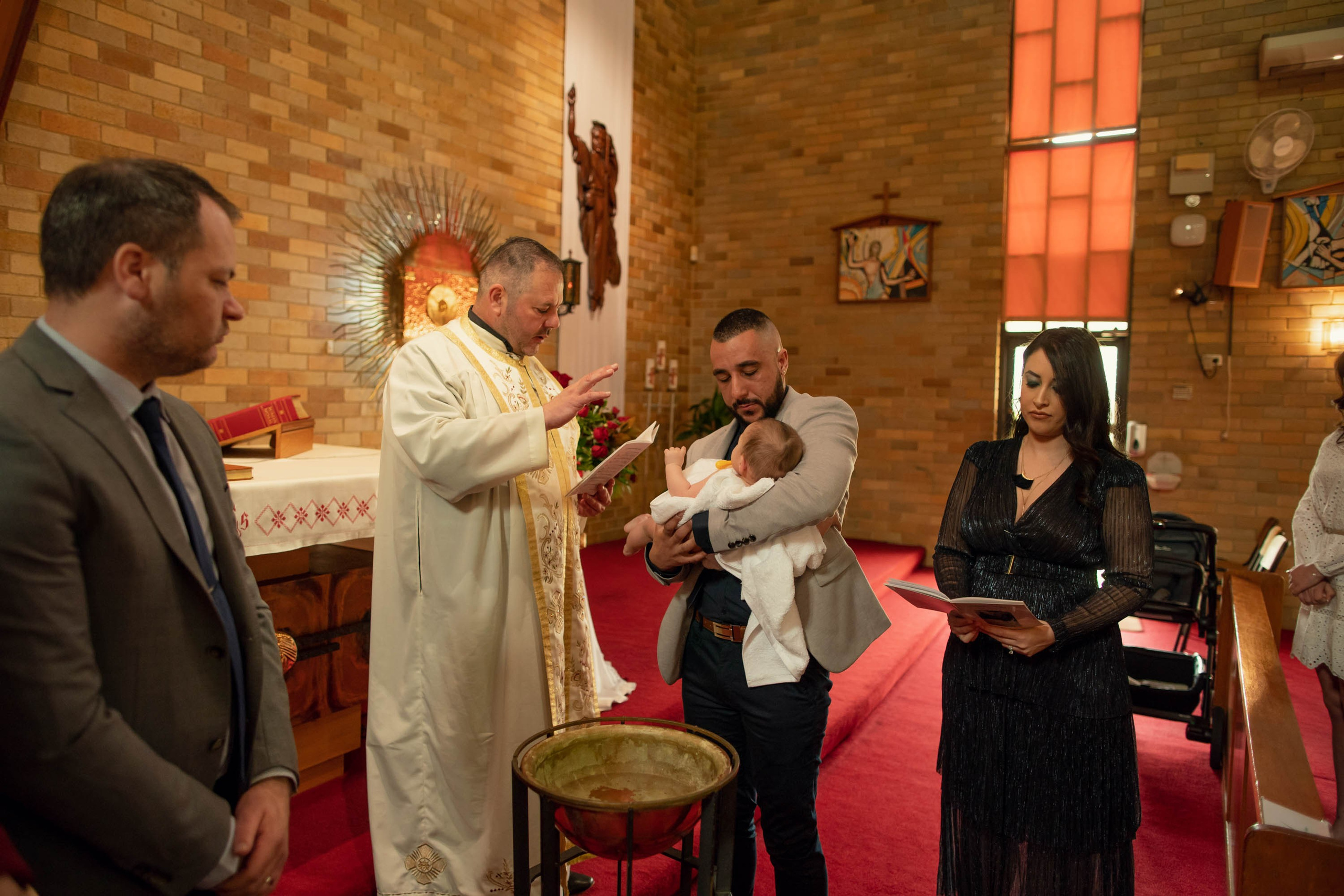 christening photography Sydney, baptism photographer Sydney, baby christening photos, family photographer Sydney, natural light christening photos, church christening photography, reception photography, candid family moments, christening day storytelling, full christening photoshoot experience
