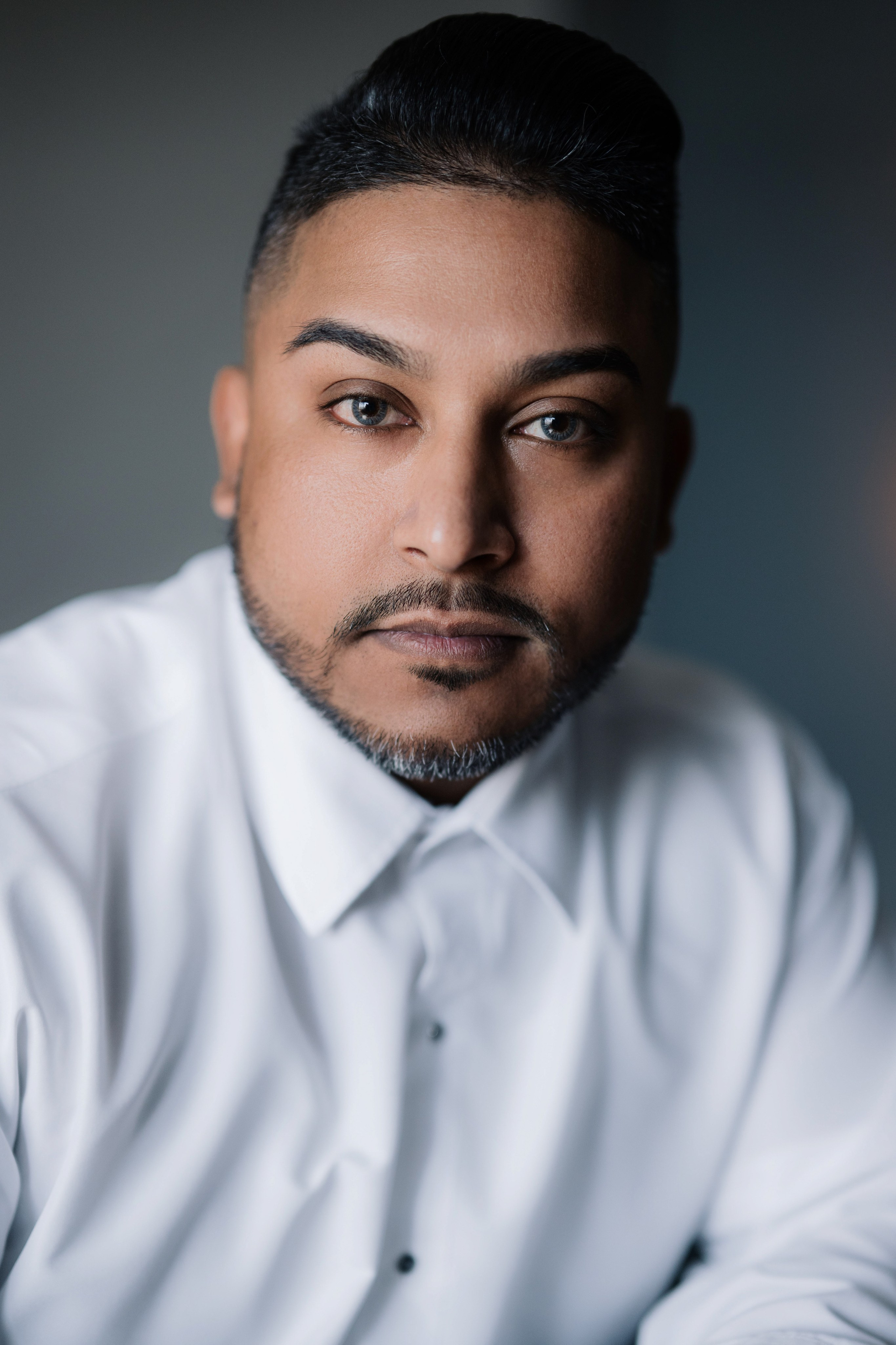 a man with a white shirt and a black tie