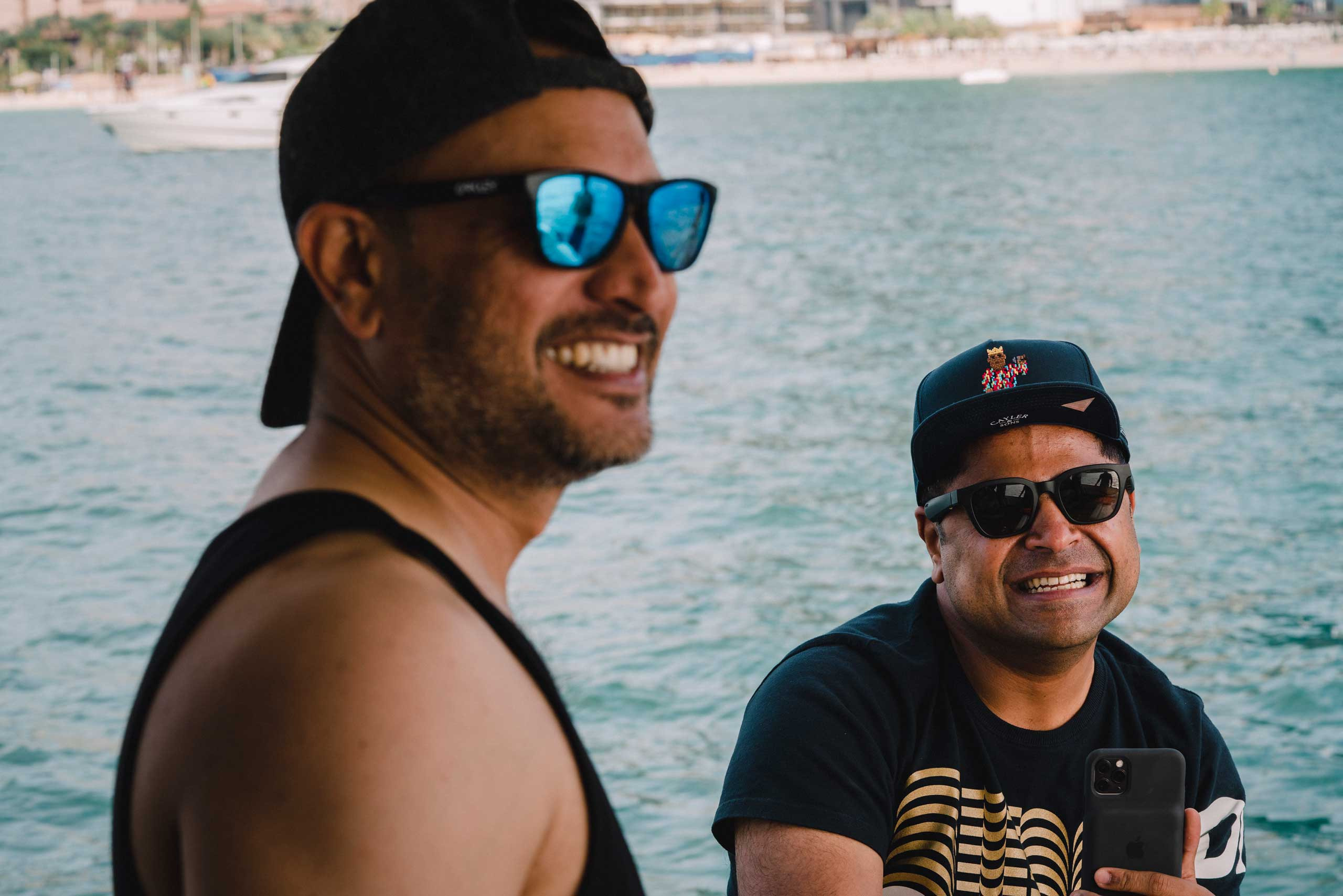 indian brothers enjoying summer wearing caps and sunglasses