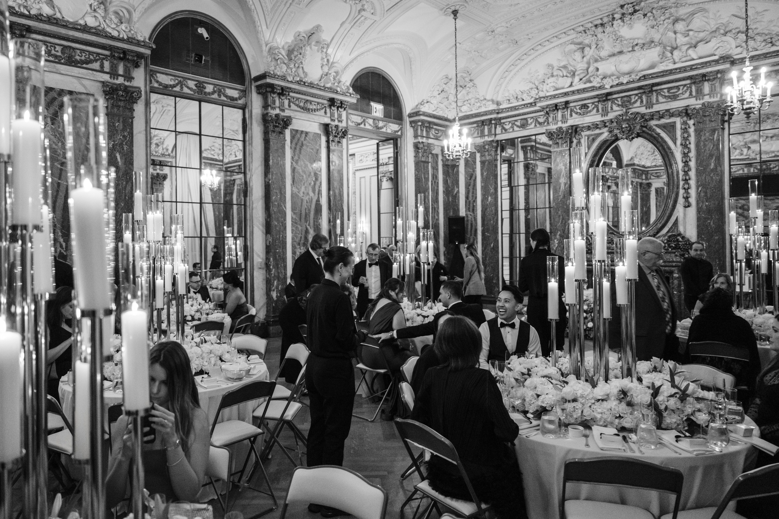 a black and white photo of a dining room