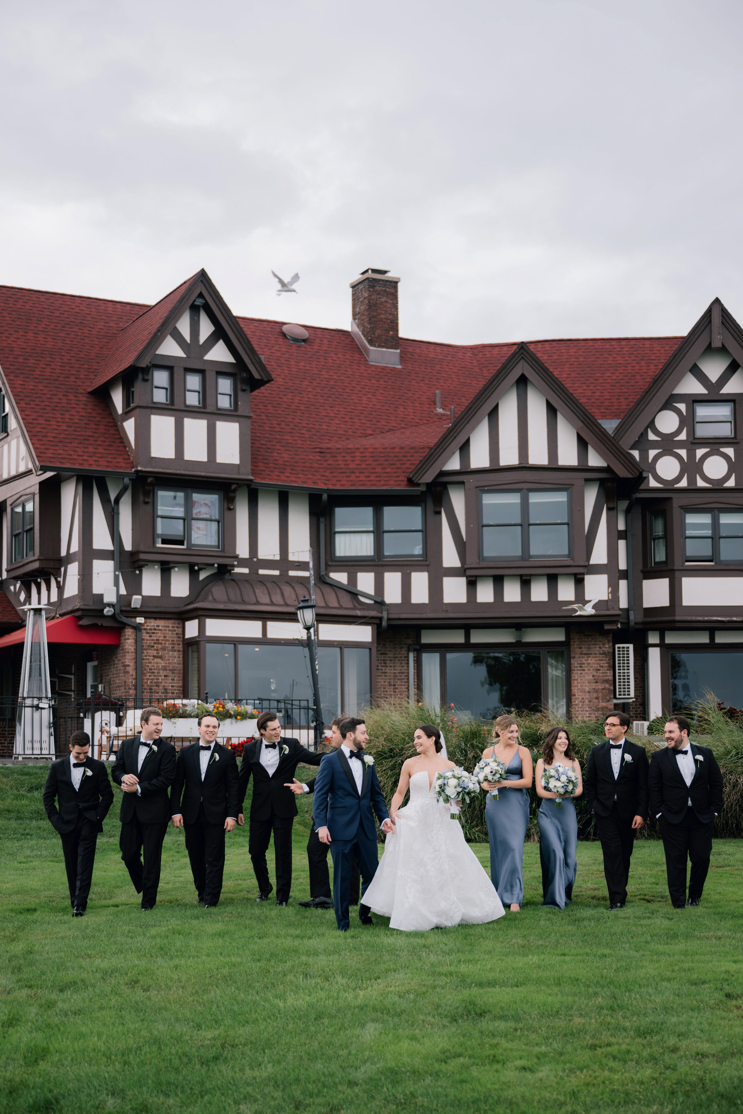 a group of people standing in front of a house