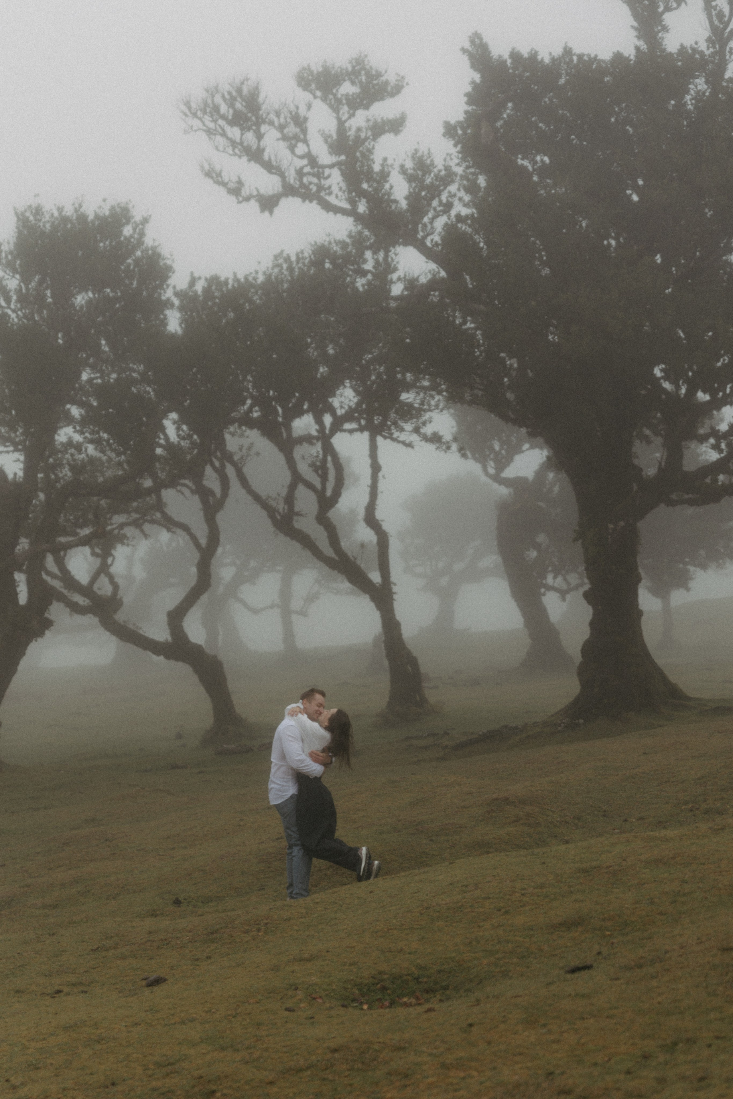 Intimate moment between couple in Fanal Forest"