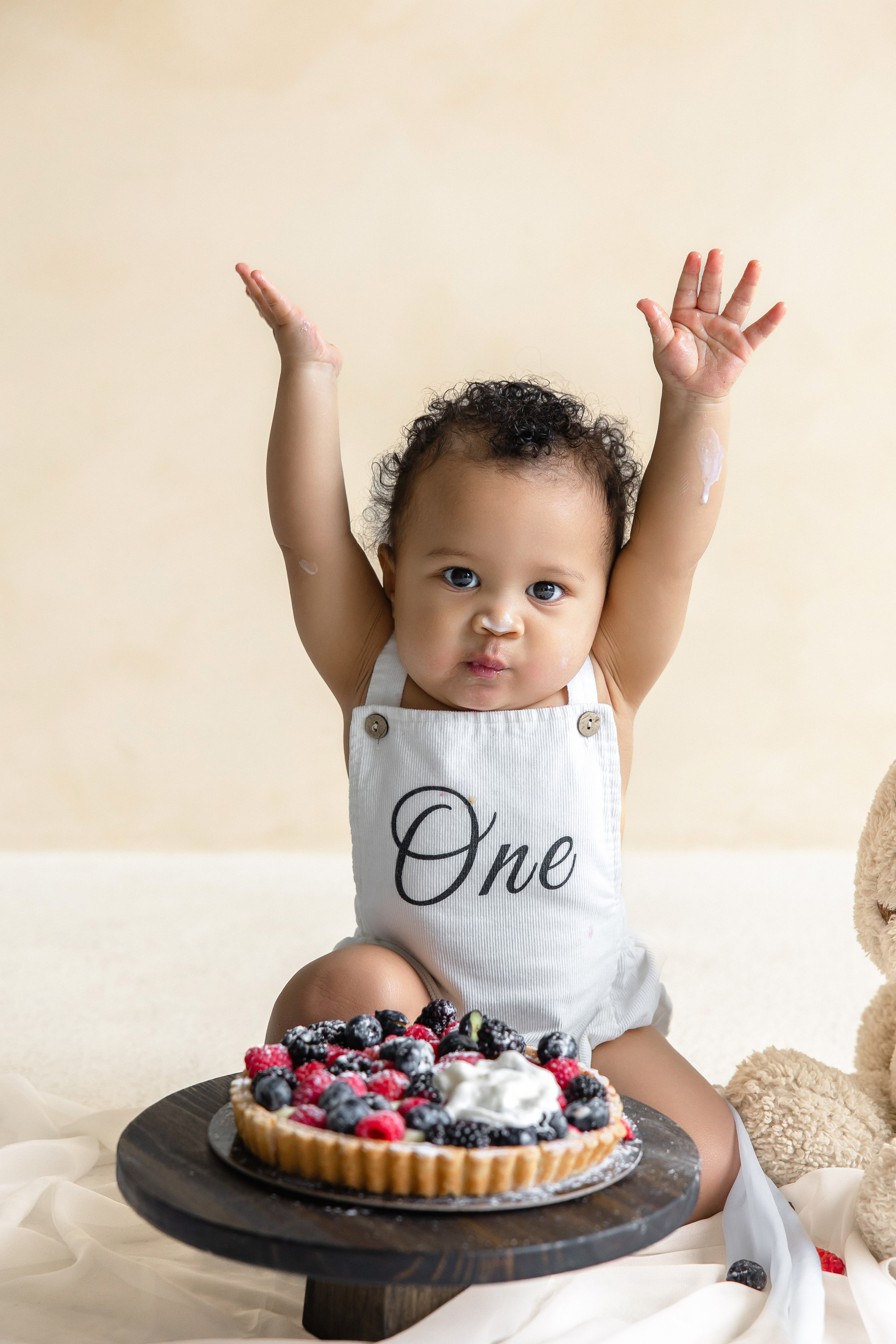 Smiling baby during cake smash session
