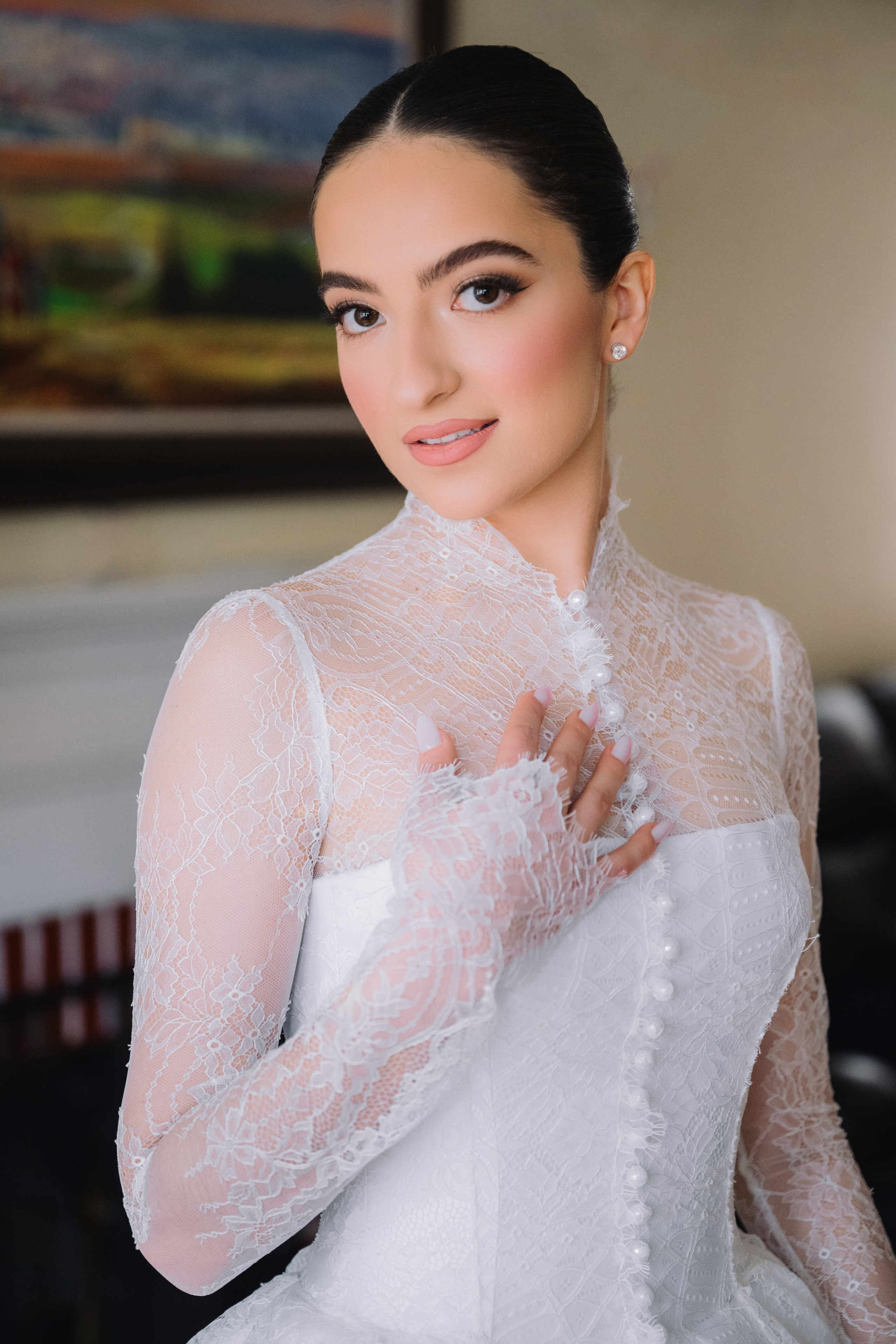 a woman in a white dress posing for the camera