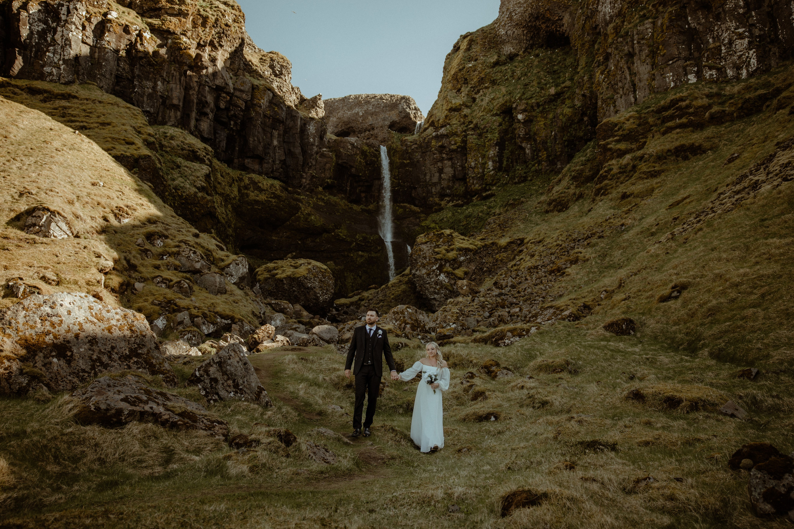 Iceland elopement at Budir with midnight sun wedding photos at black sand beach. Iceland elopement photographer & videographer