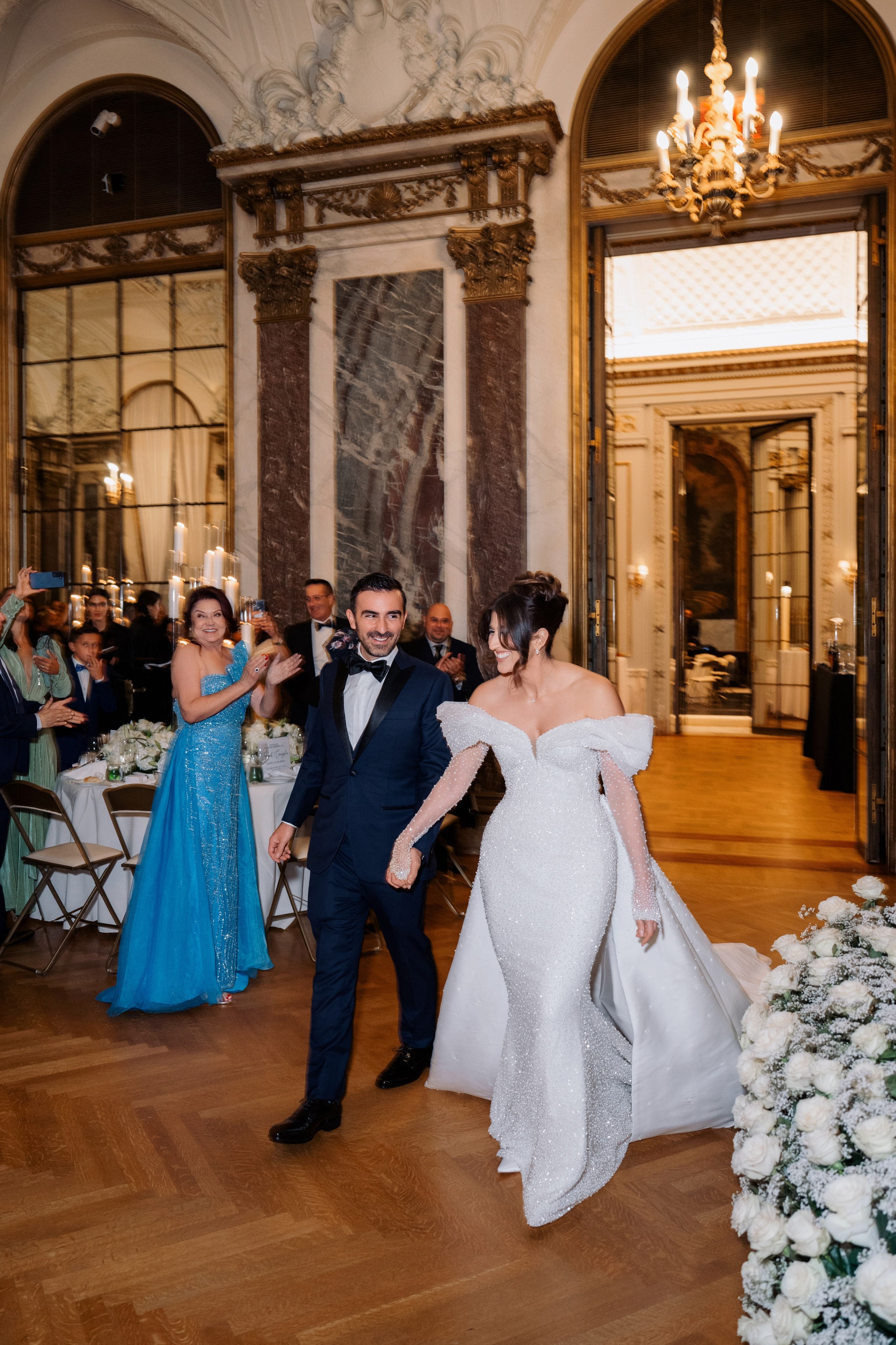 a bride and groom dancing in a ballroom