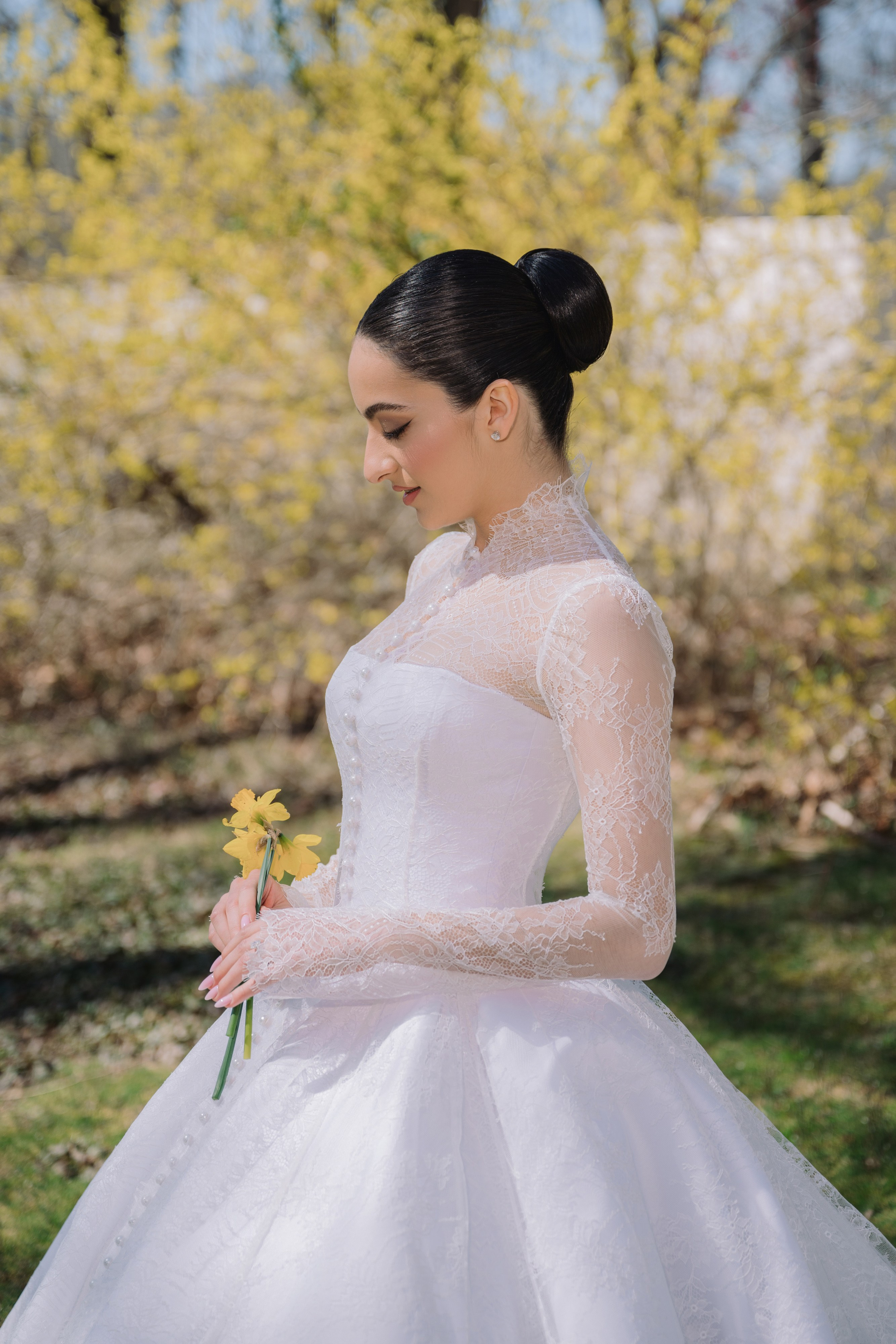 a woman in a white dress holding a flower