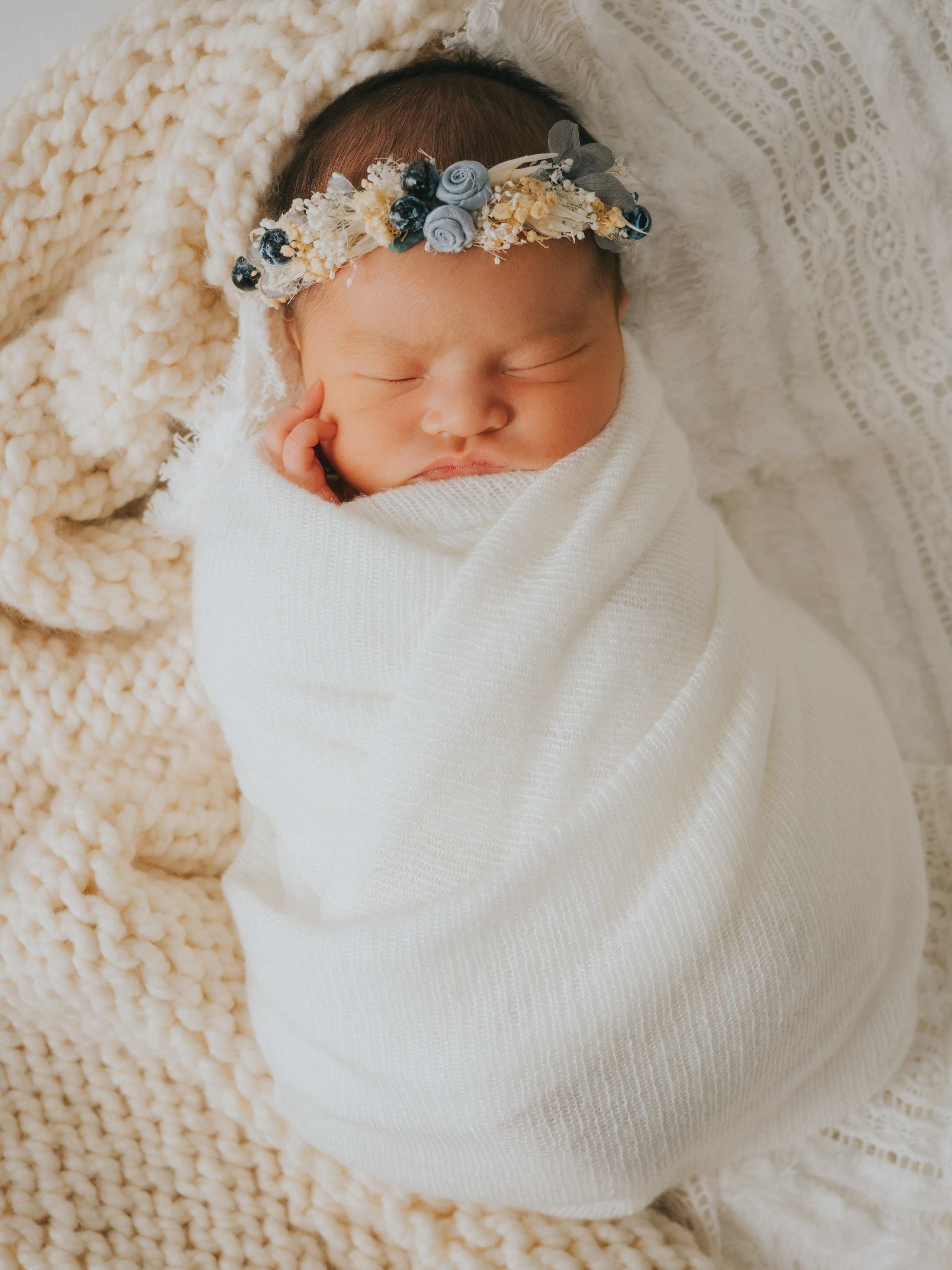 Newborn photography of baby sleeping.