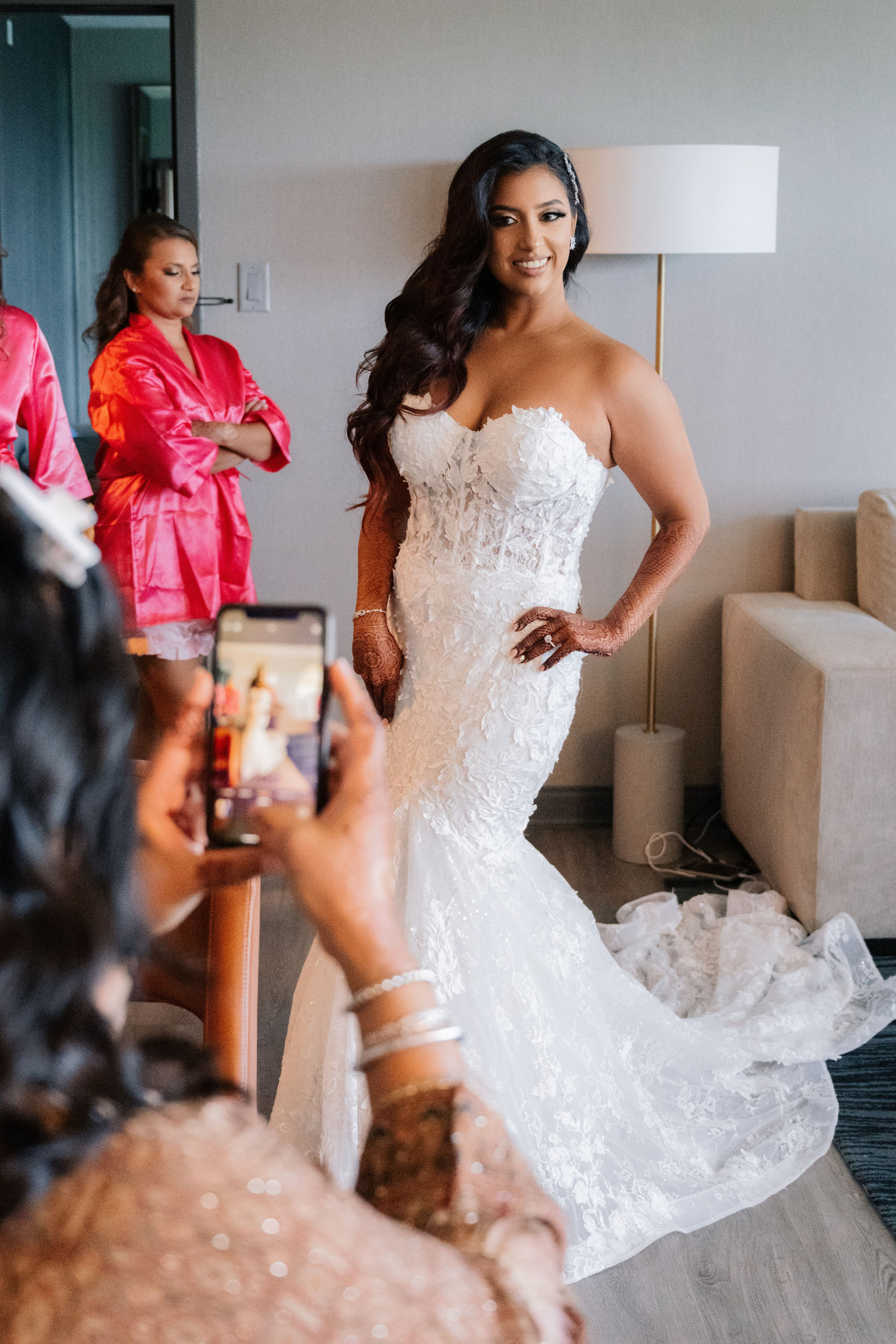 a bride is taking a picture of her wedding dress