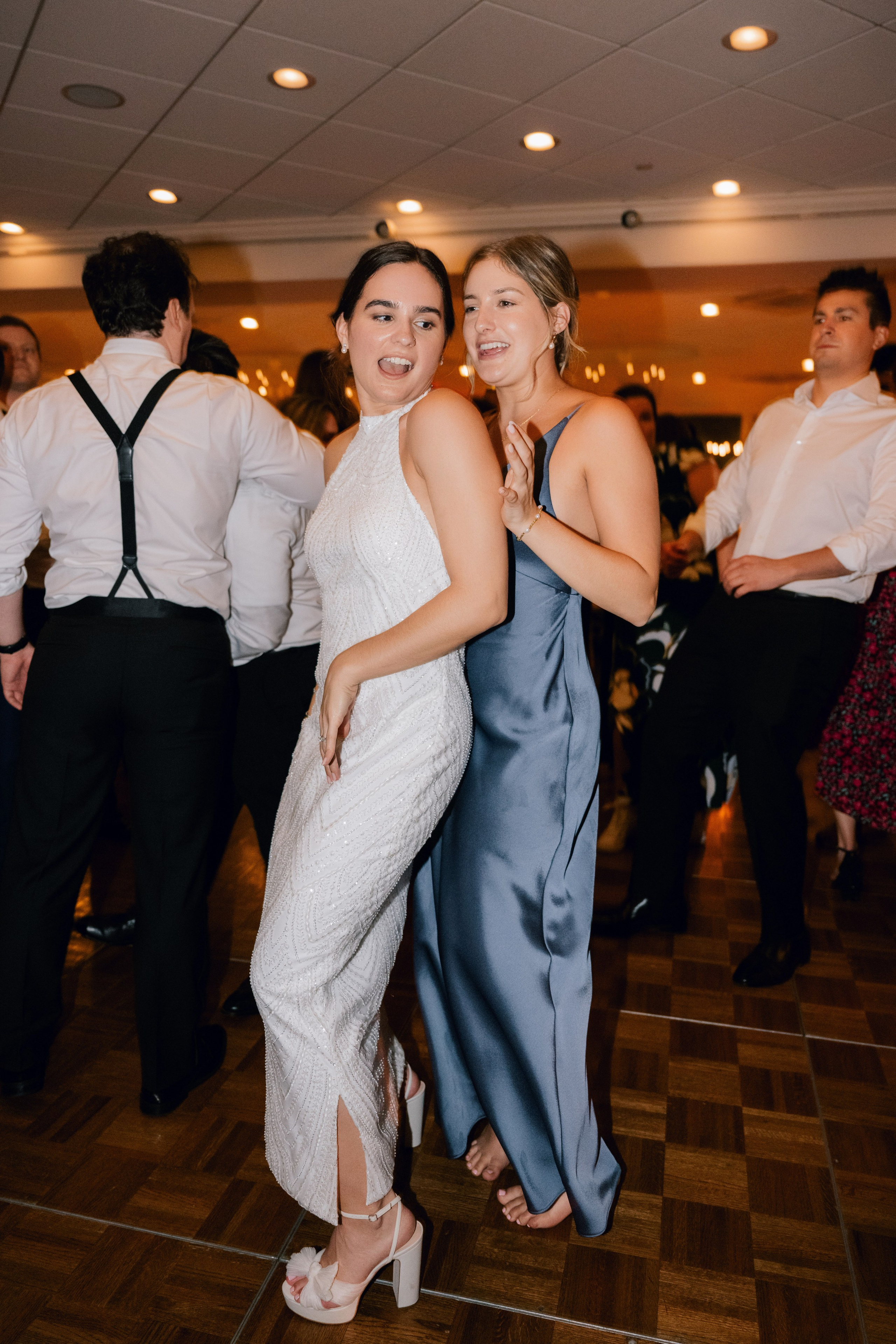 two women dancing on a dance floor