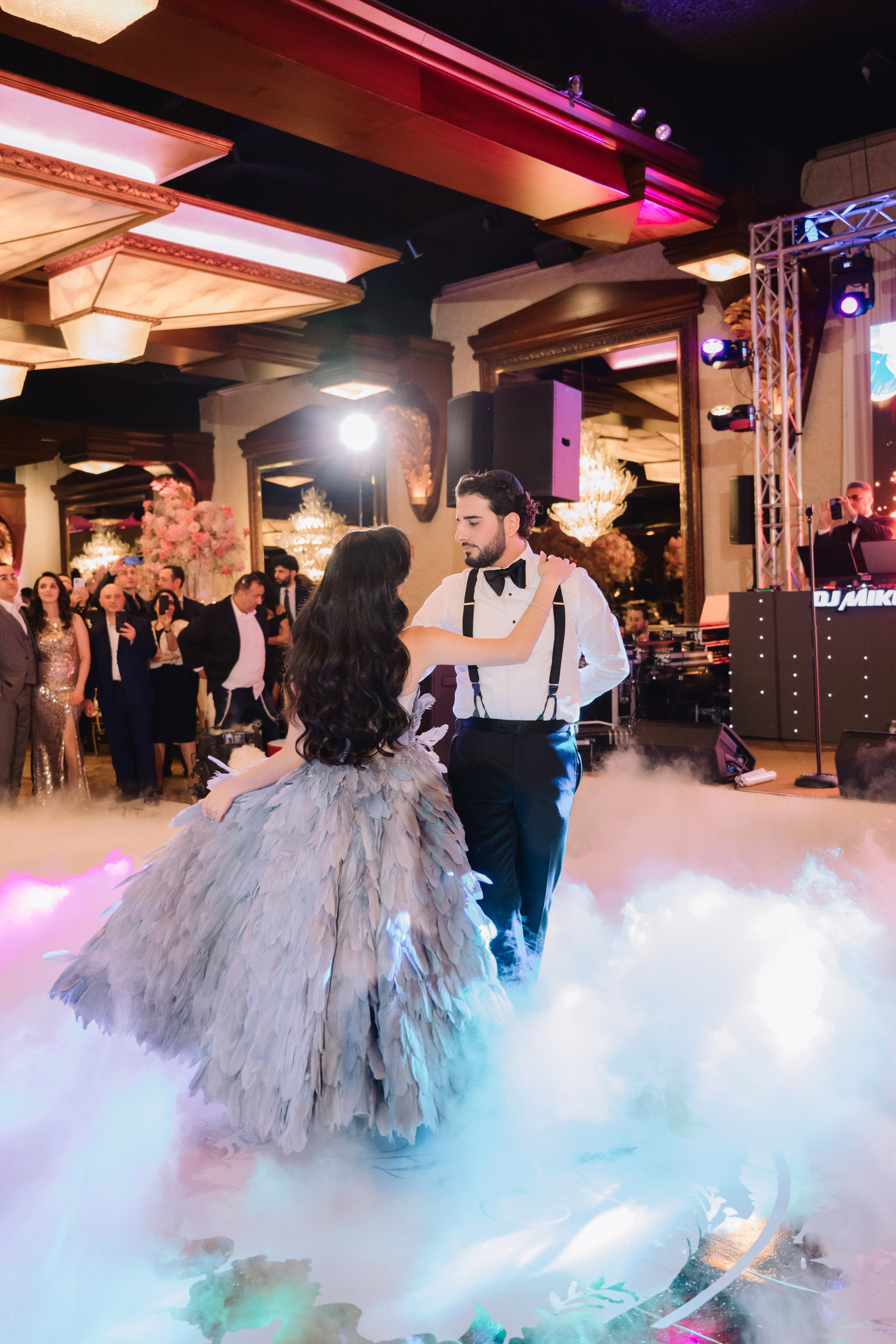 a couple dancing on a cloud of smoke