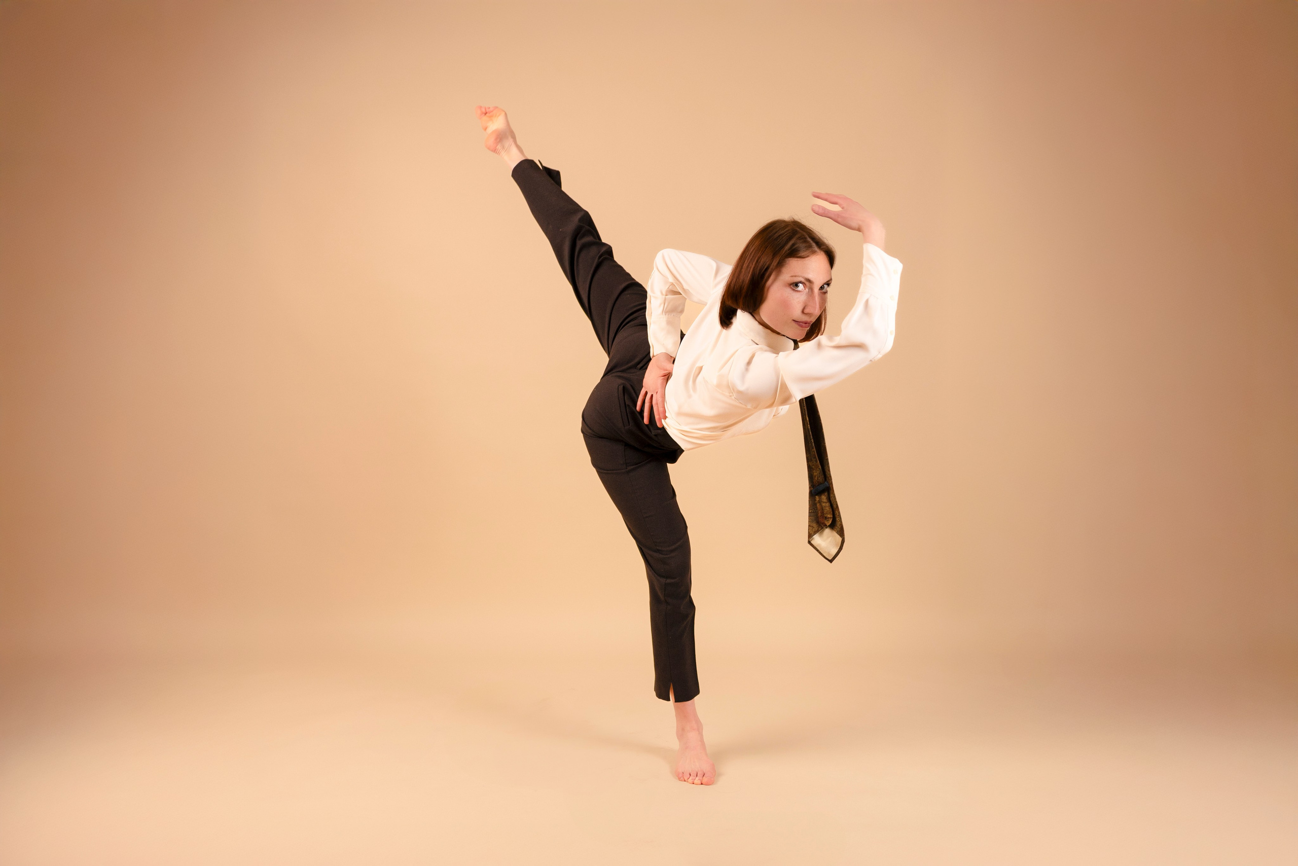Ballet dancer posing in studio during portfolio photoshoot
