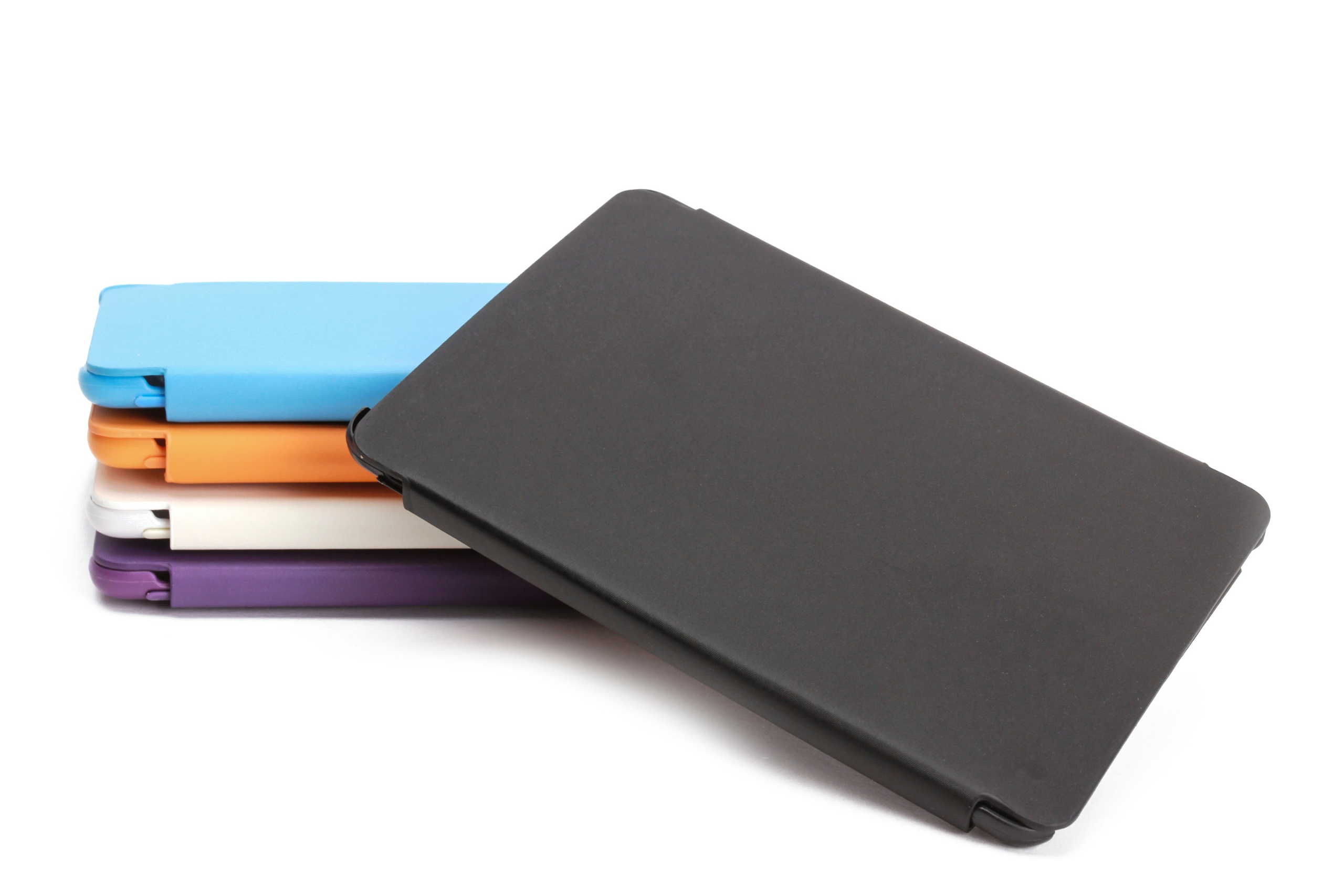 Collection of tablet covers in various colors, arranged in a neat stack