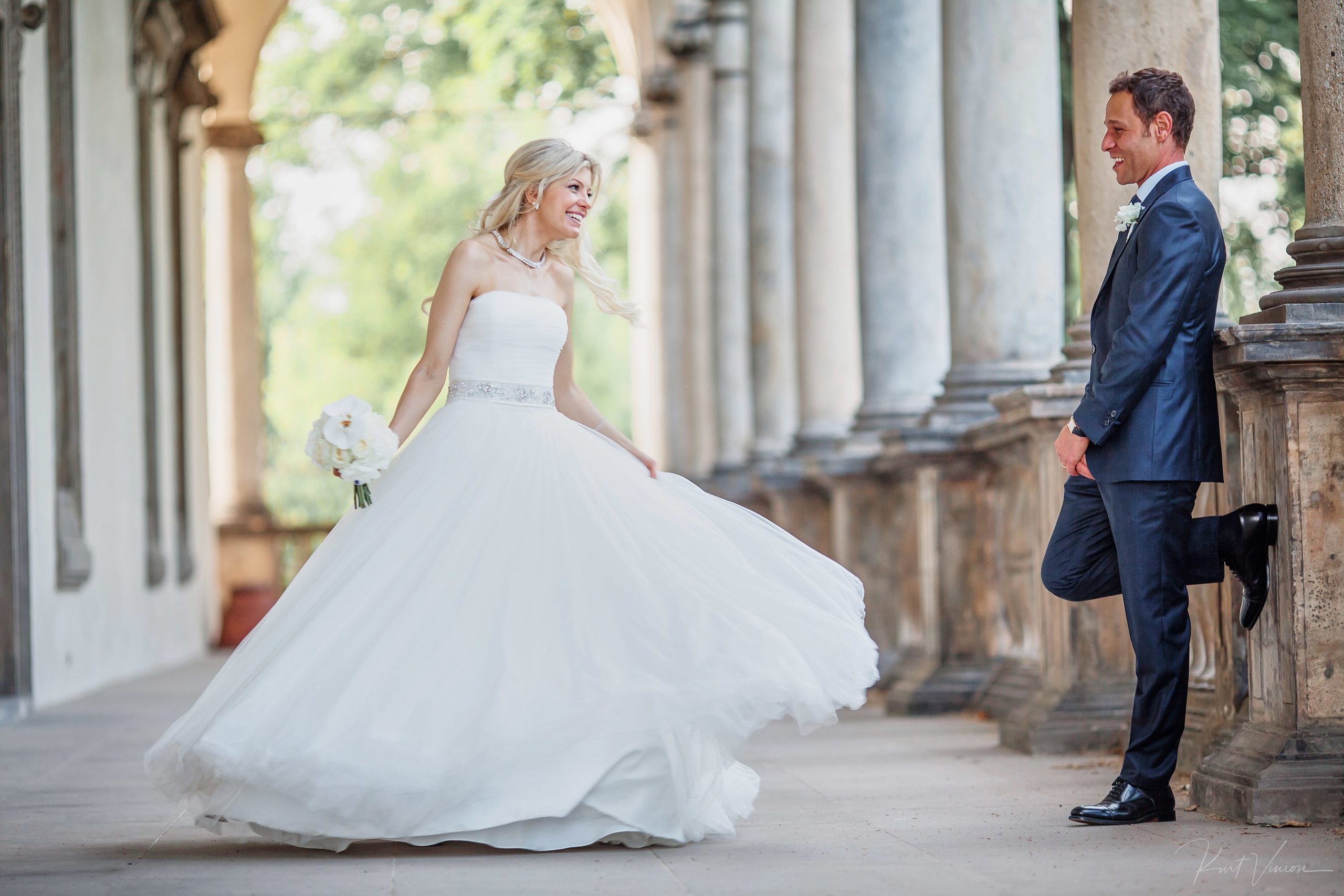 Bride twirling in wedding dress at Queen Anne's Summer Palace Prague