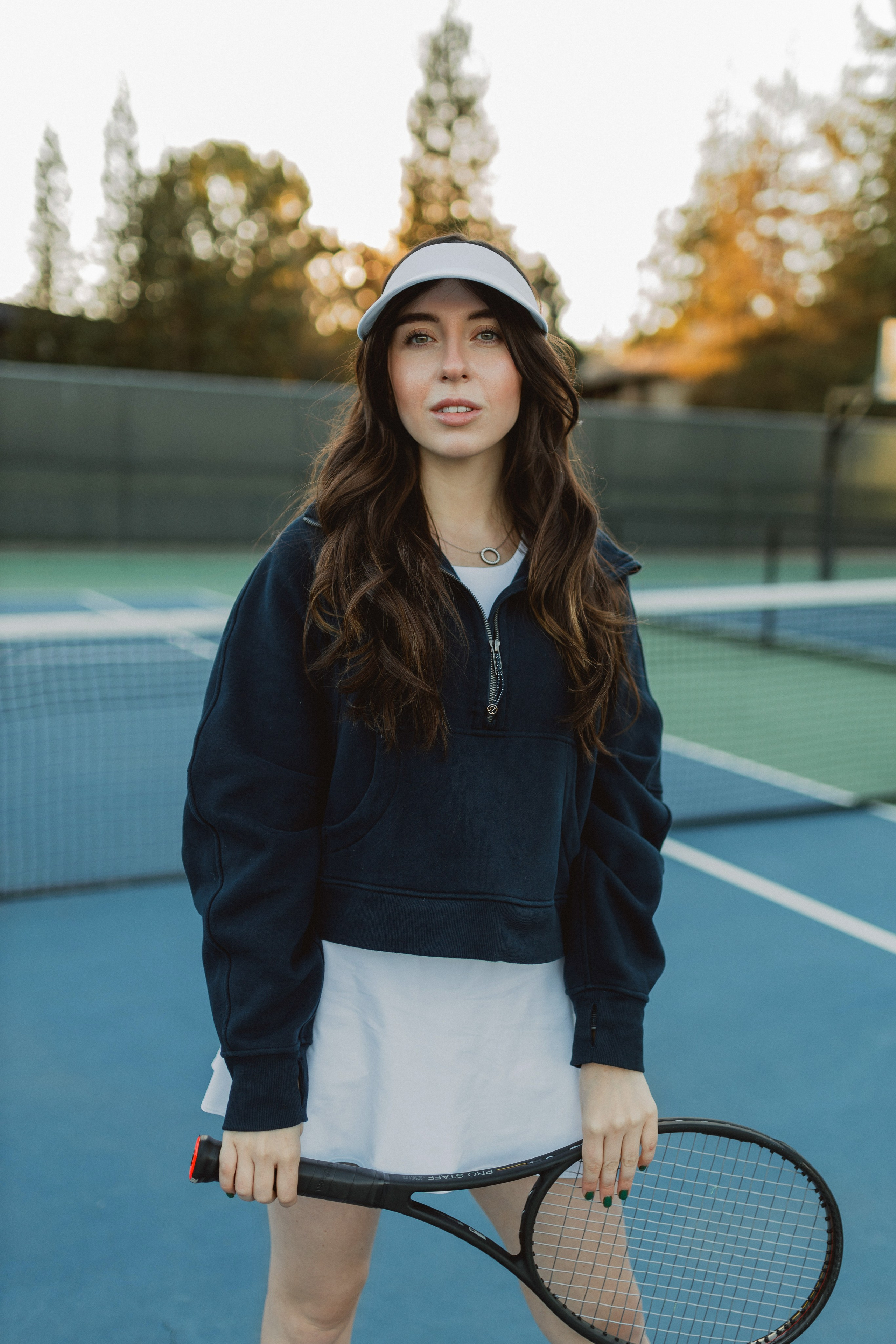 Woman in tennis outfit during creative Bay Area photoshoot