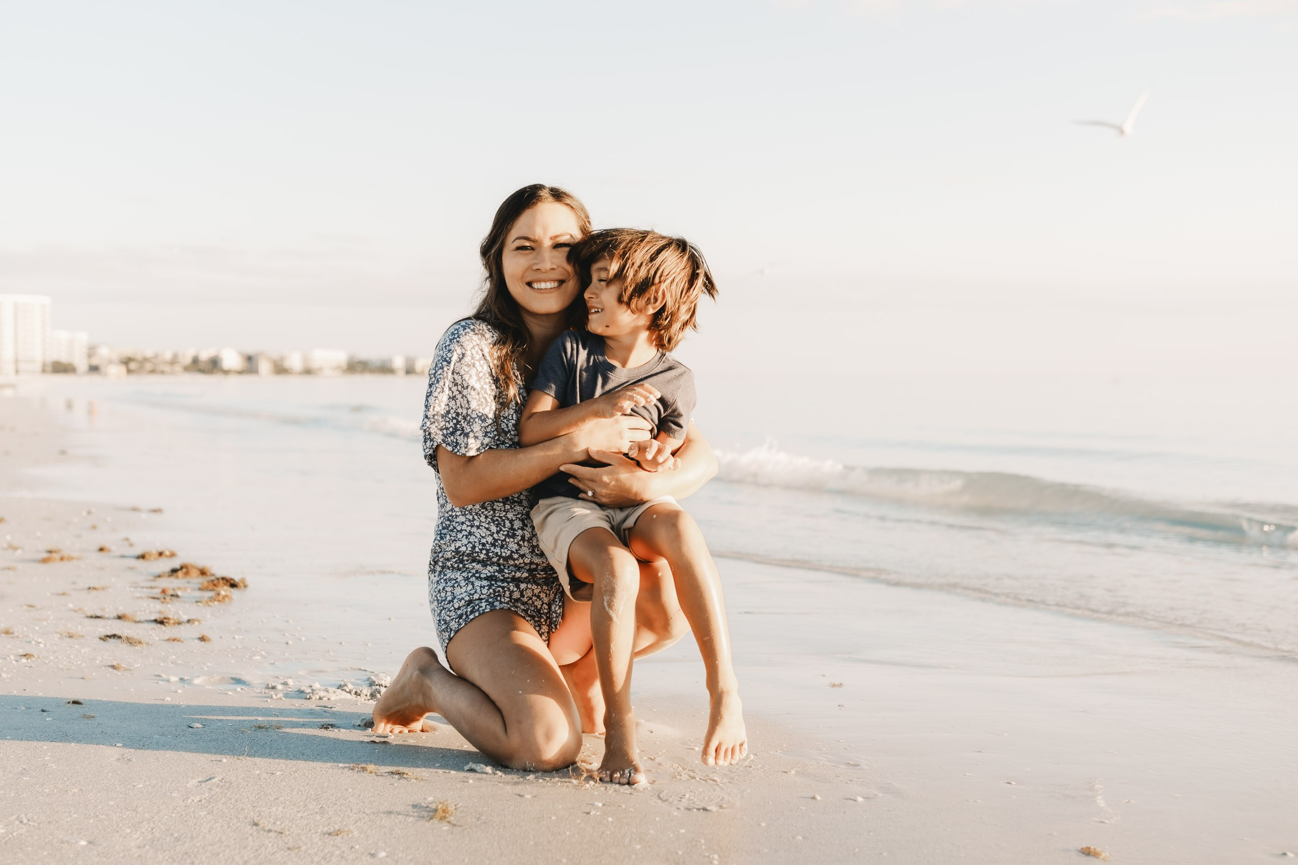 Mother holding her sun during a family beach photoshoot in Sarasota, Florida.