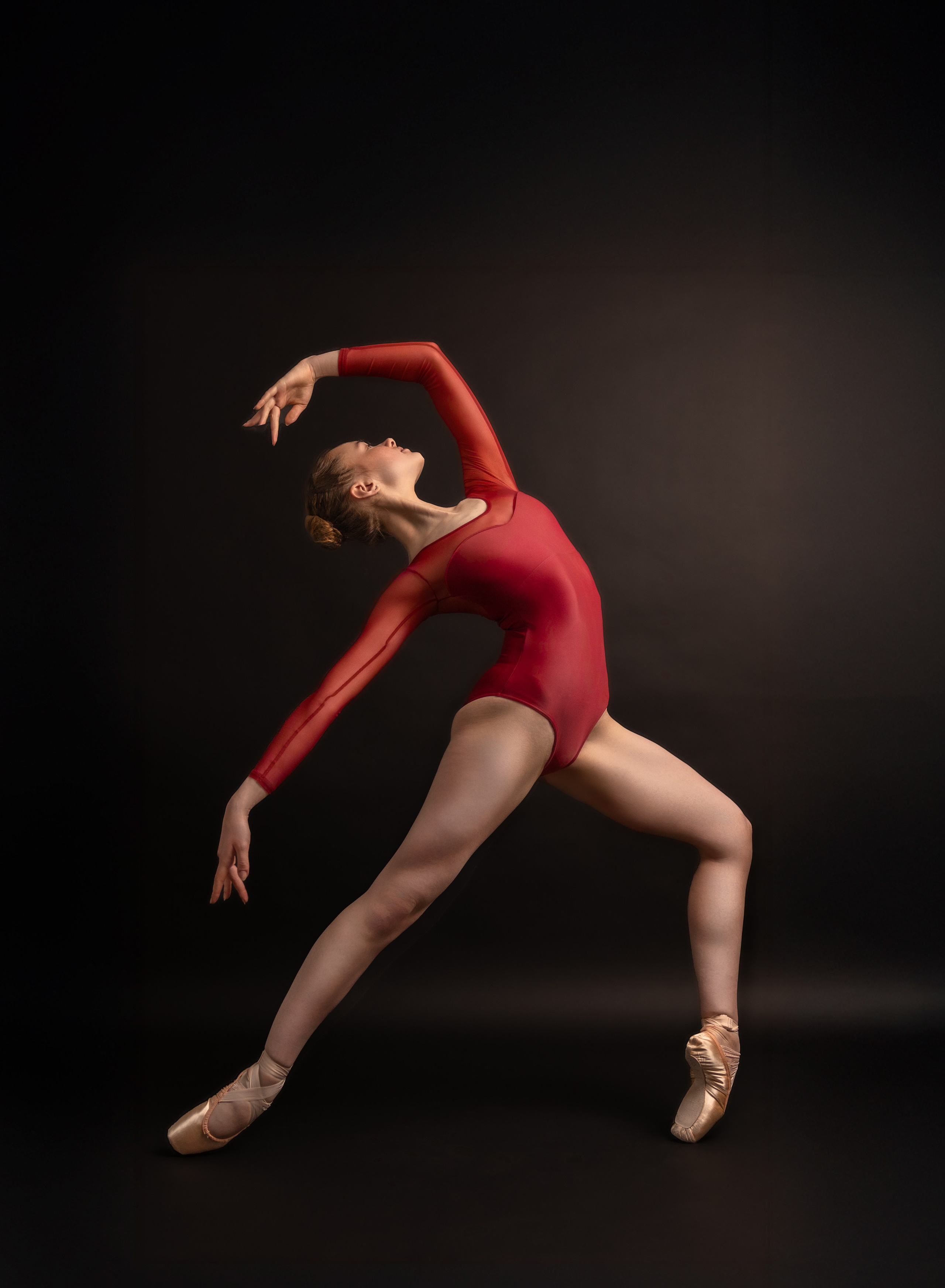 Ballet dancer posing in studio during portfolio photoshoot