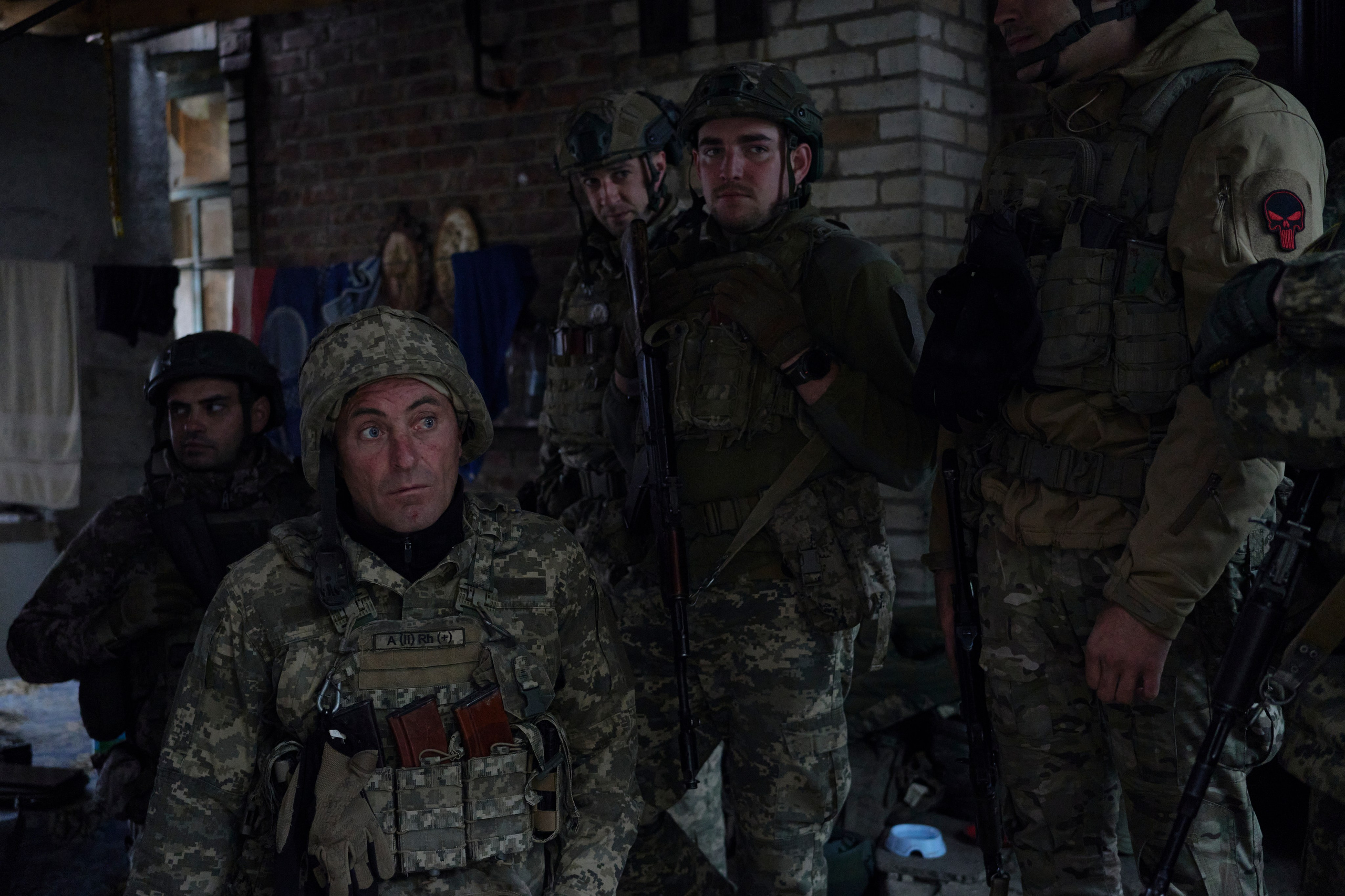 Soldiers of infantry unit of 22nd Mechanized brigade listening to the instructions before moving to positions.