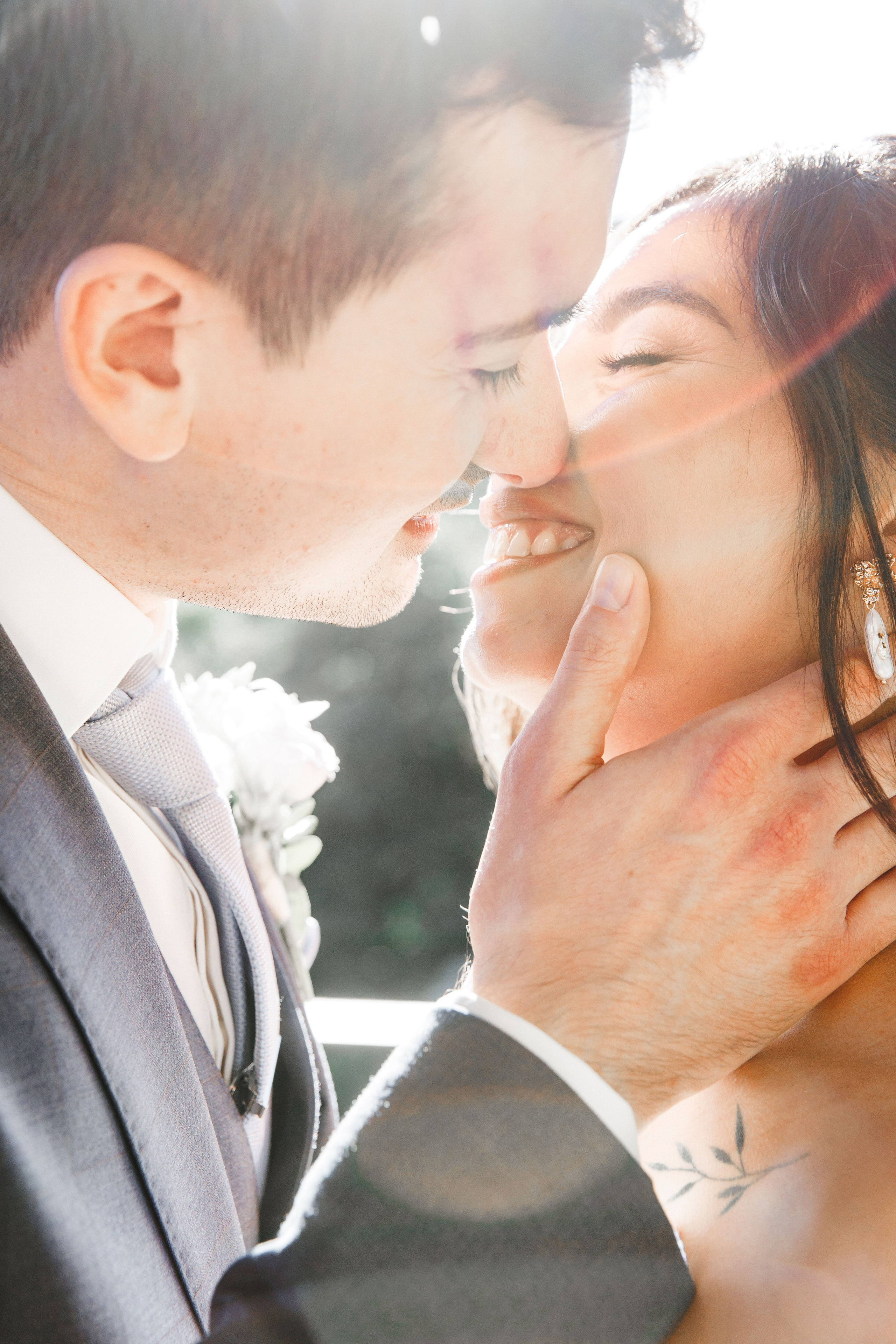Bride and groom sharing a romantic look during their wedding portrait session in Barcelona, capturing pure happiness.