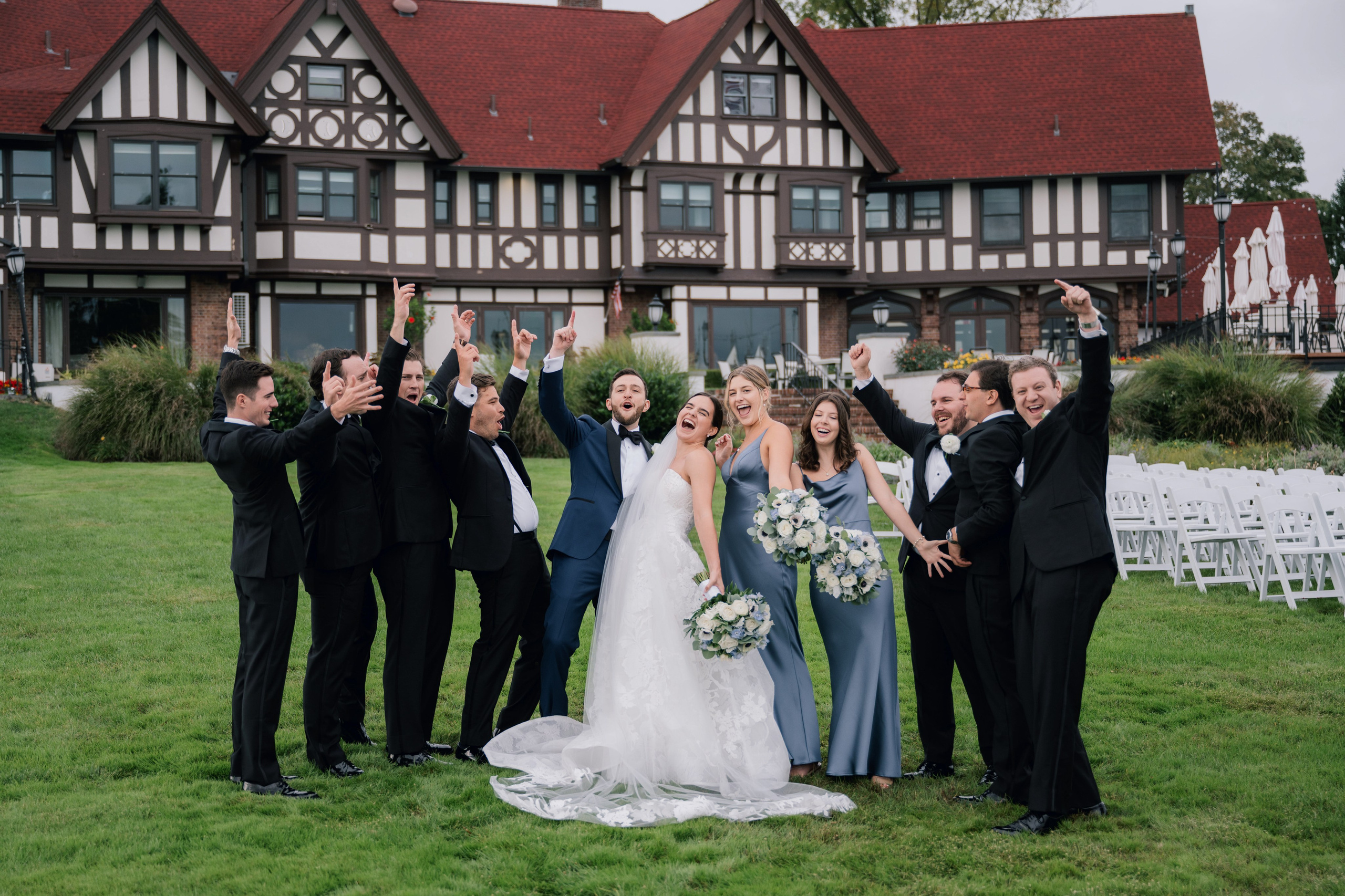 a group of people standing in front of a house