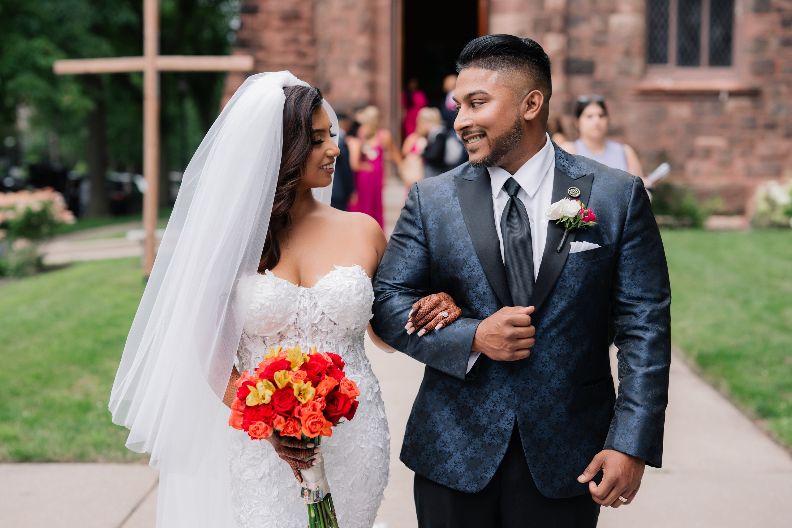 a bride and groom walking down the aisle