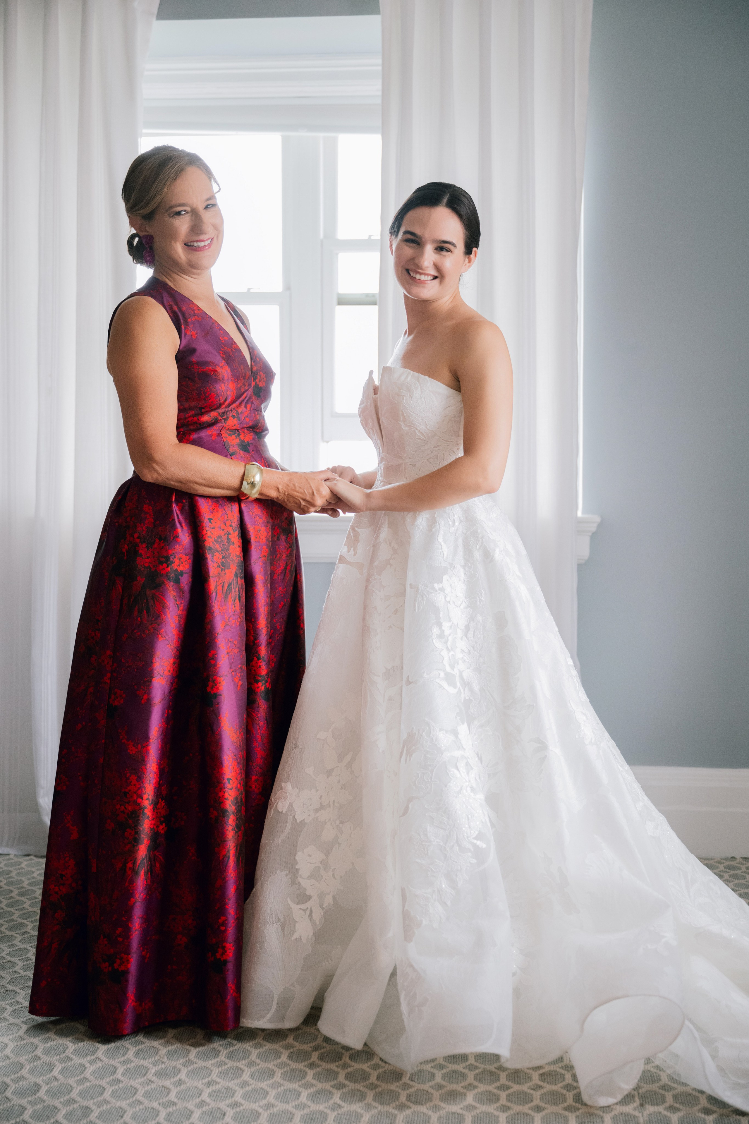 a bride and her mother in a room
