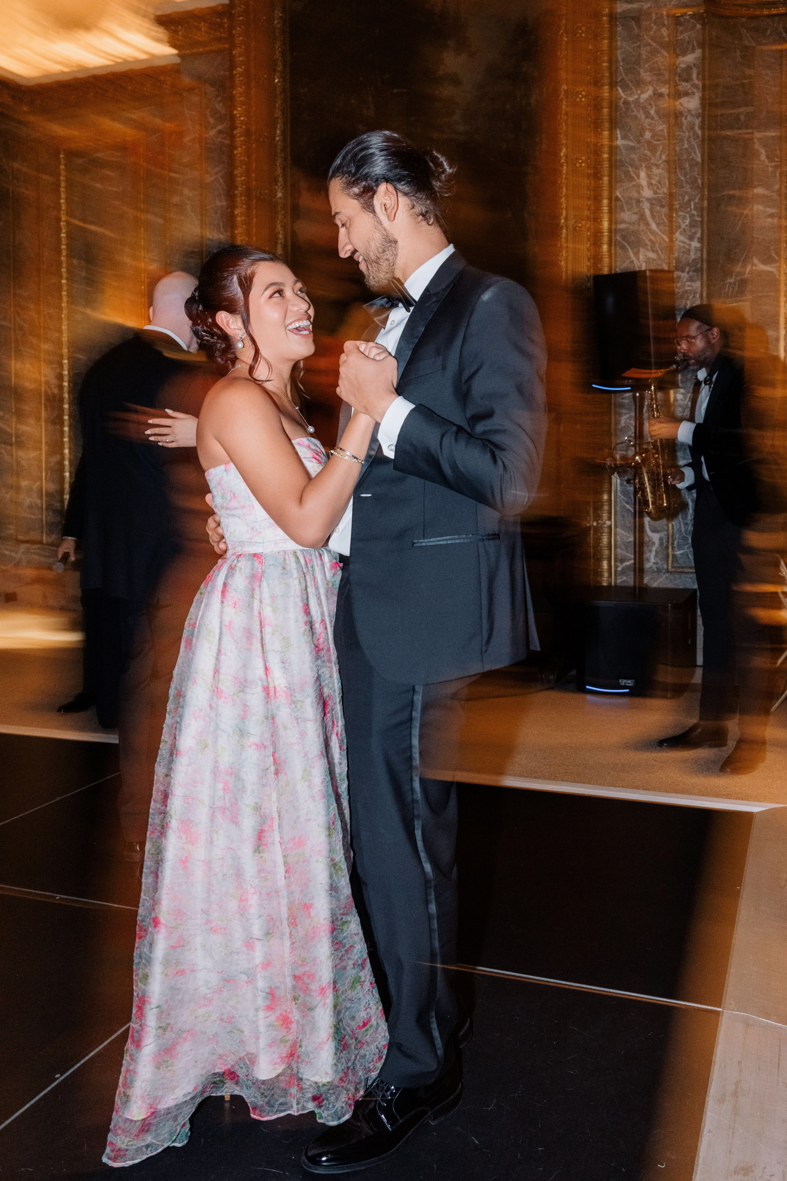a man and woman dancing in a room