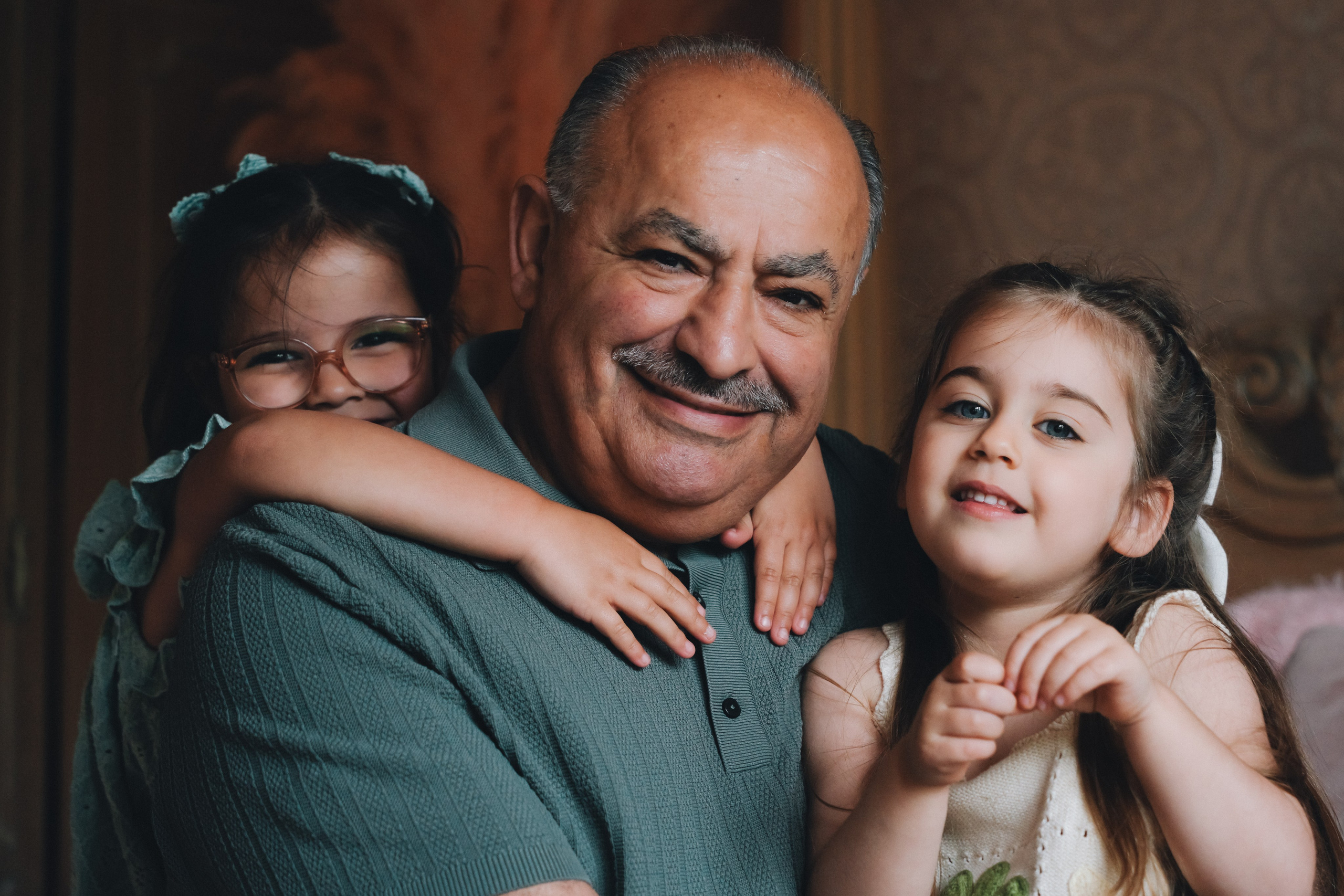 Happy family portrait with grandparent and children smiling together, Birmingham