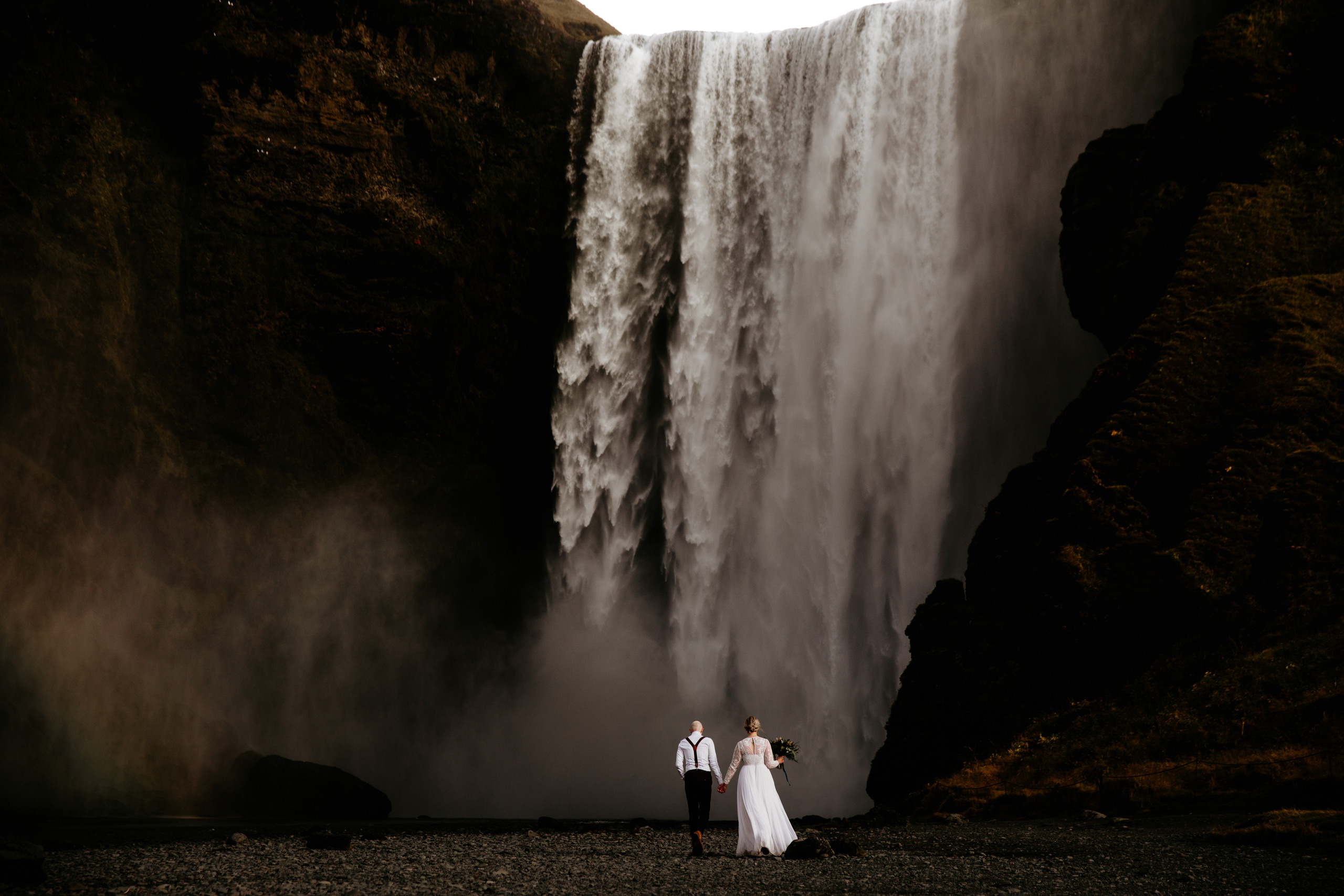 couple in front of Skogafoss