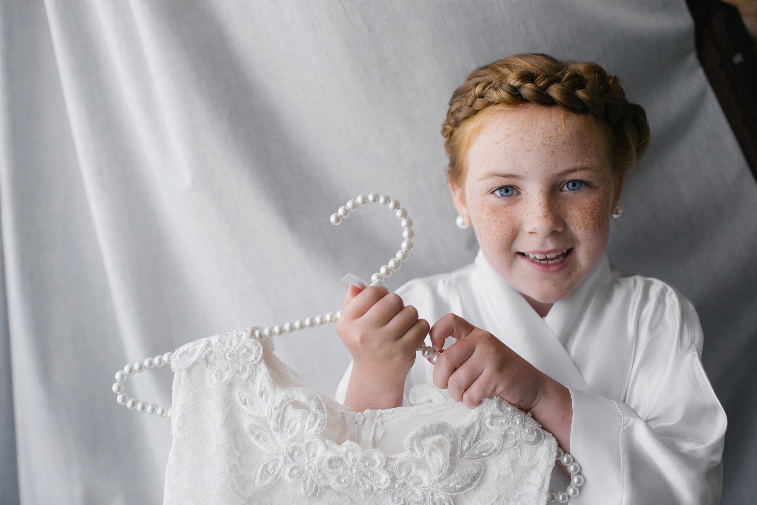 Girl holding the wedding dress
