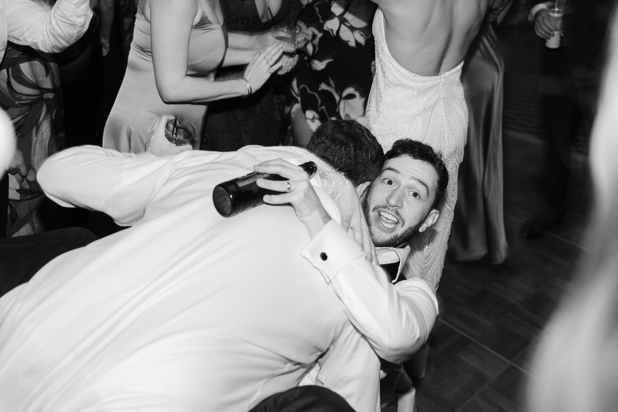 a man is dancing with a woman in a white dress