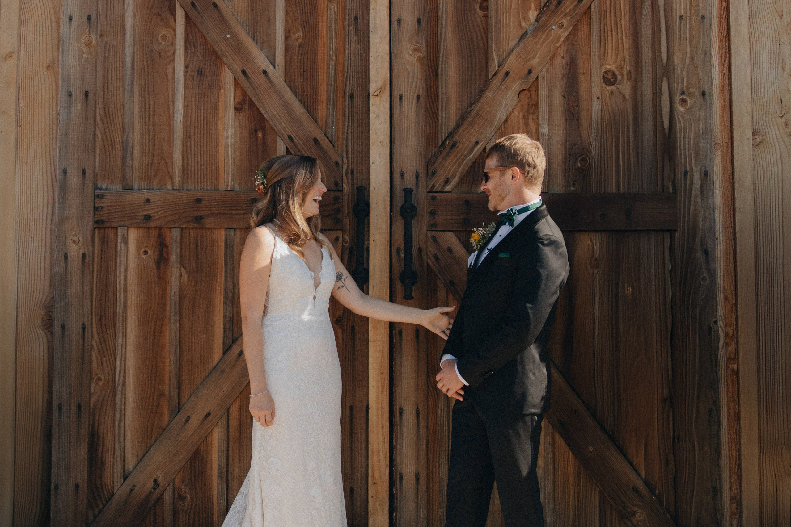 Jessie and Isaac on their wedding day in Portland, Oregon – a genuine moment of joy captured by photographer Georgy Shishkin in a romantic outdoor style, reflecting the charm of Portland & Seattle wedding photography.