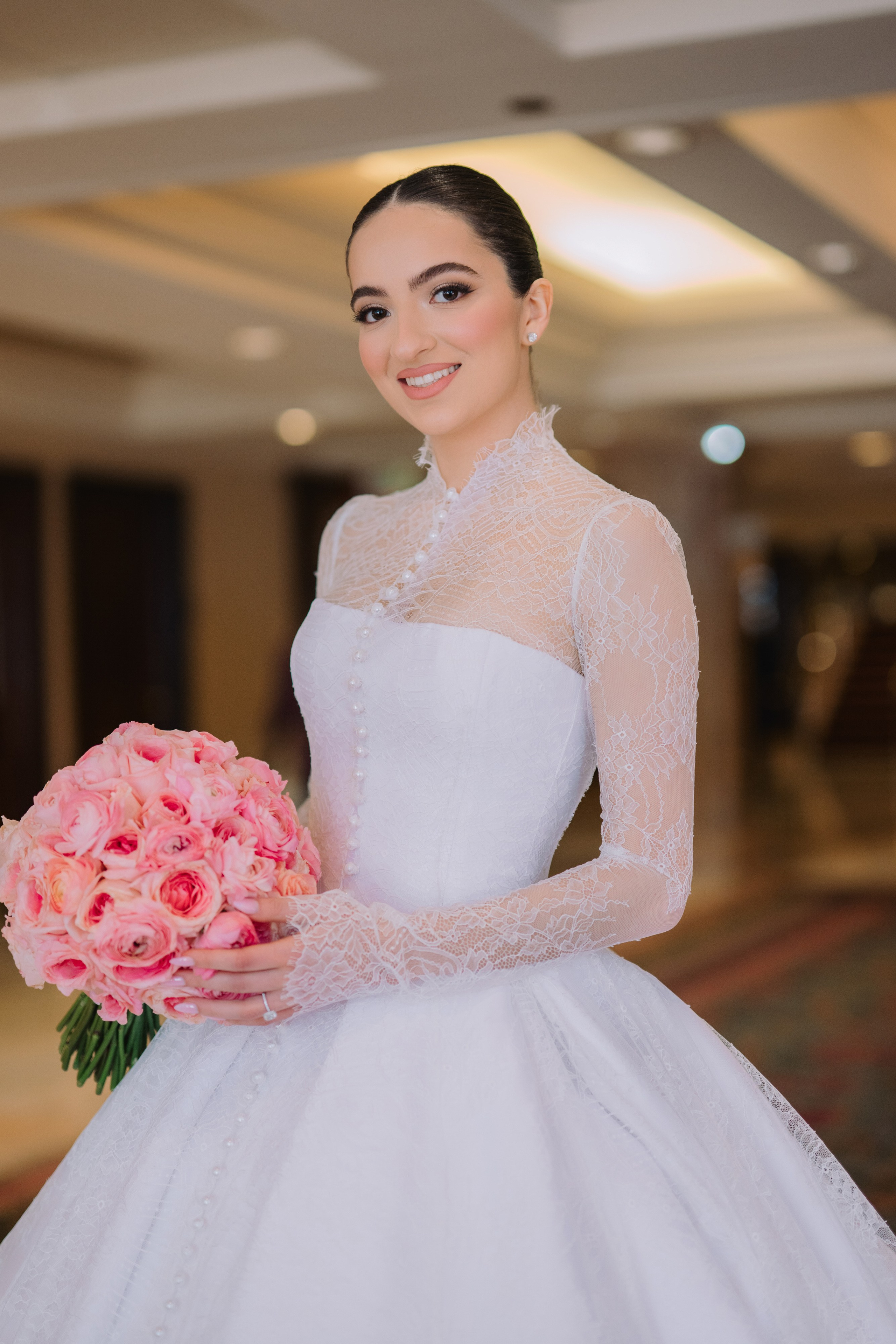 a bride holding a bouquet in her hand
