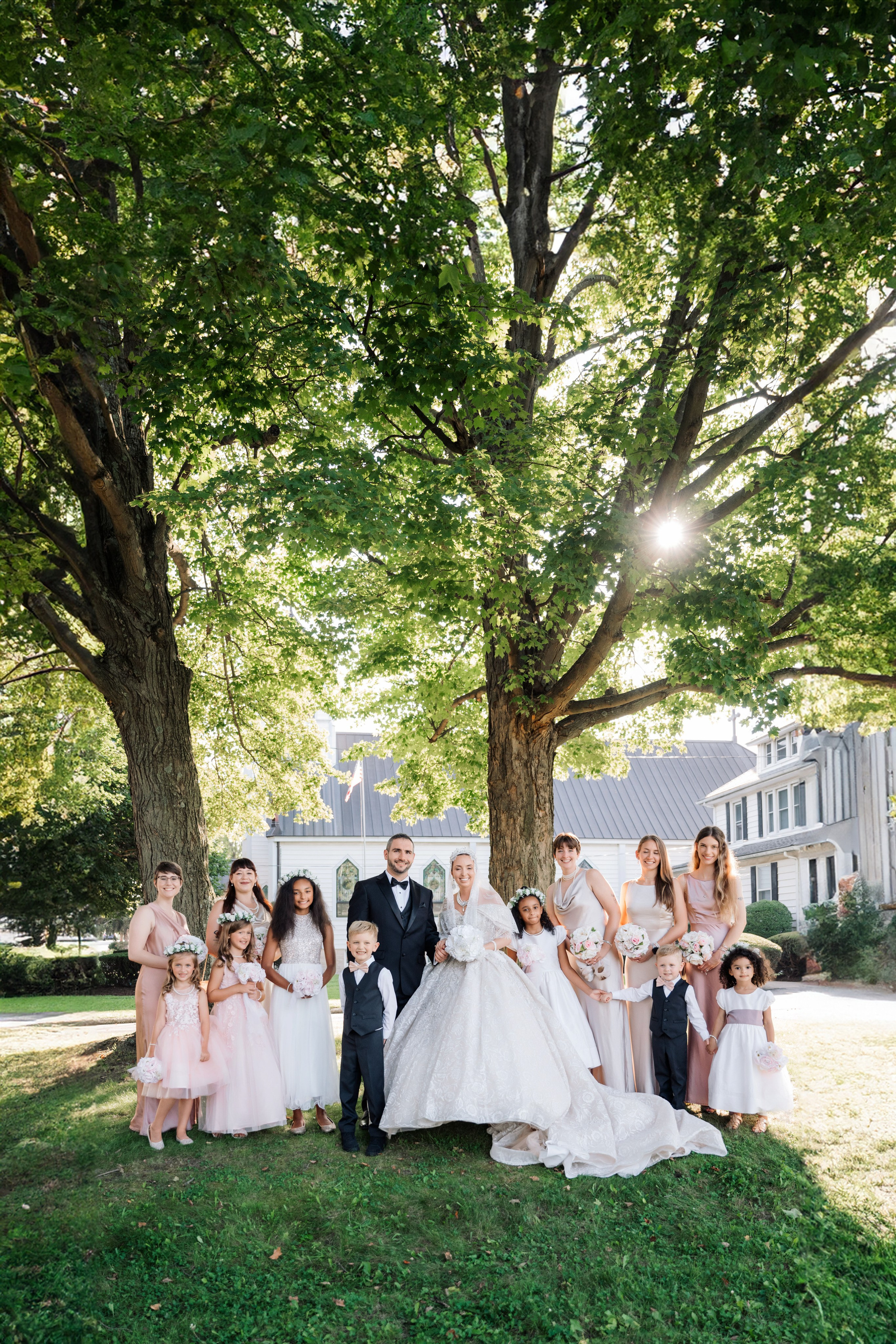 a bride and groom pose with their children