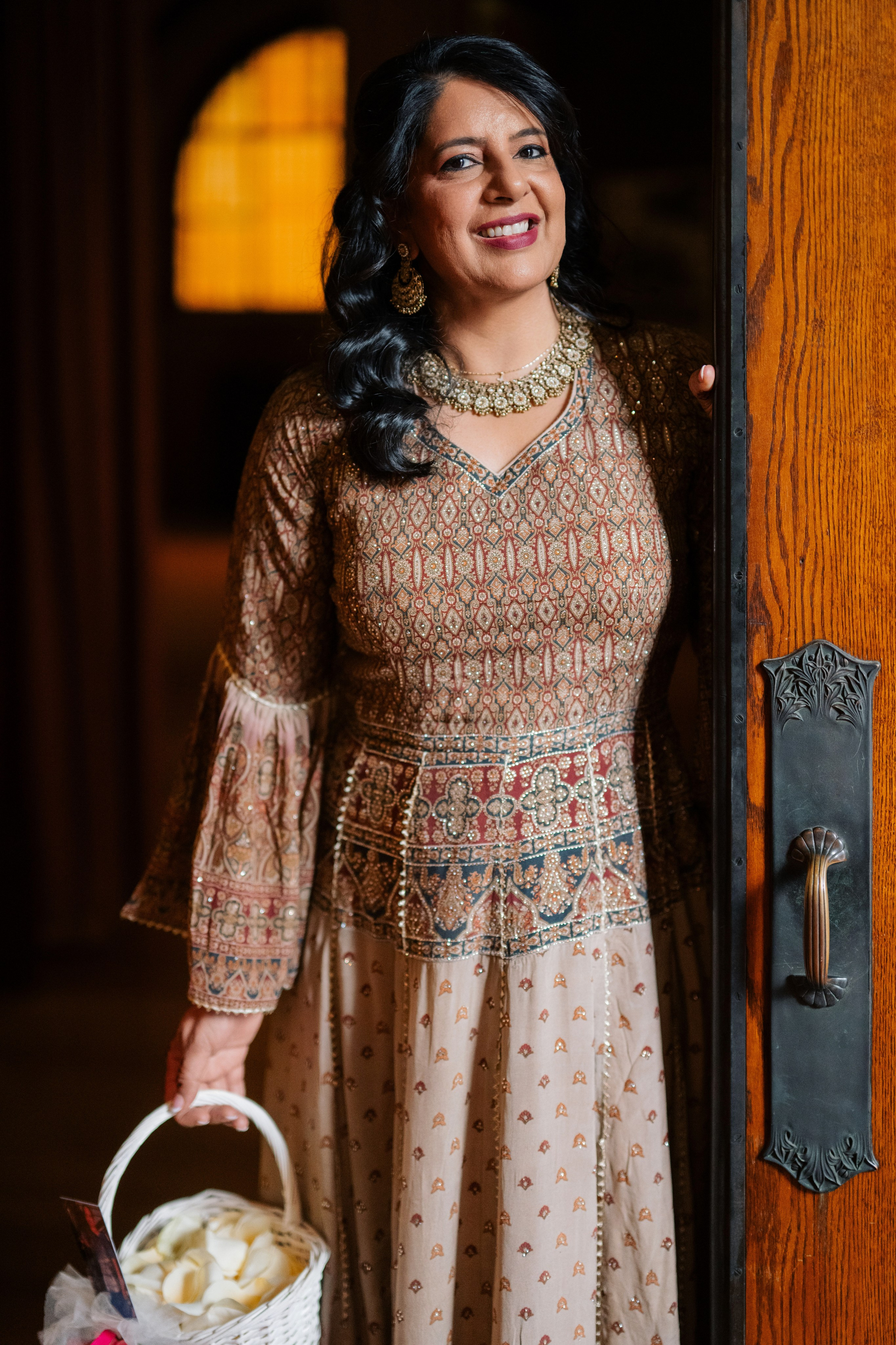 a woman in a dress holding a basket