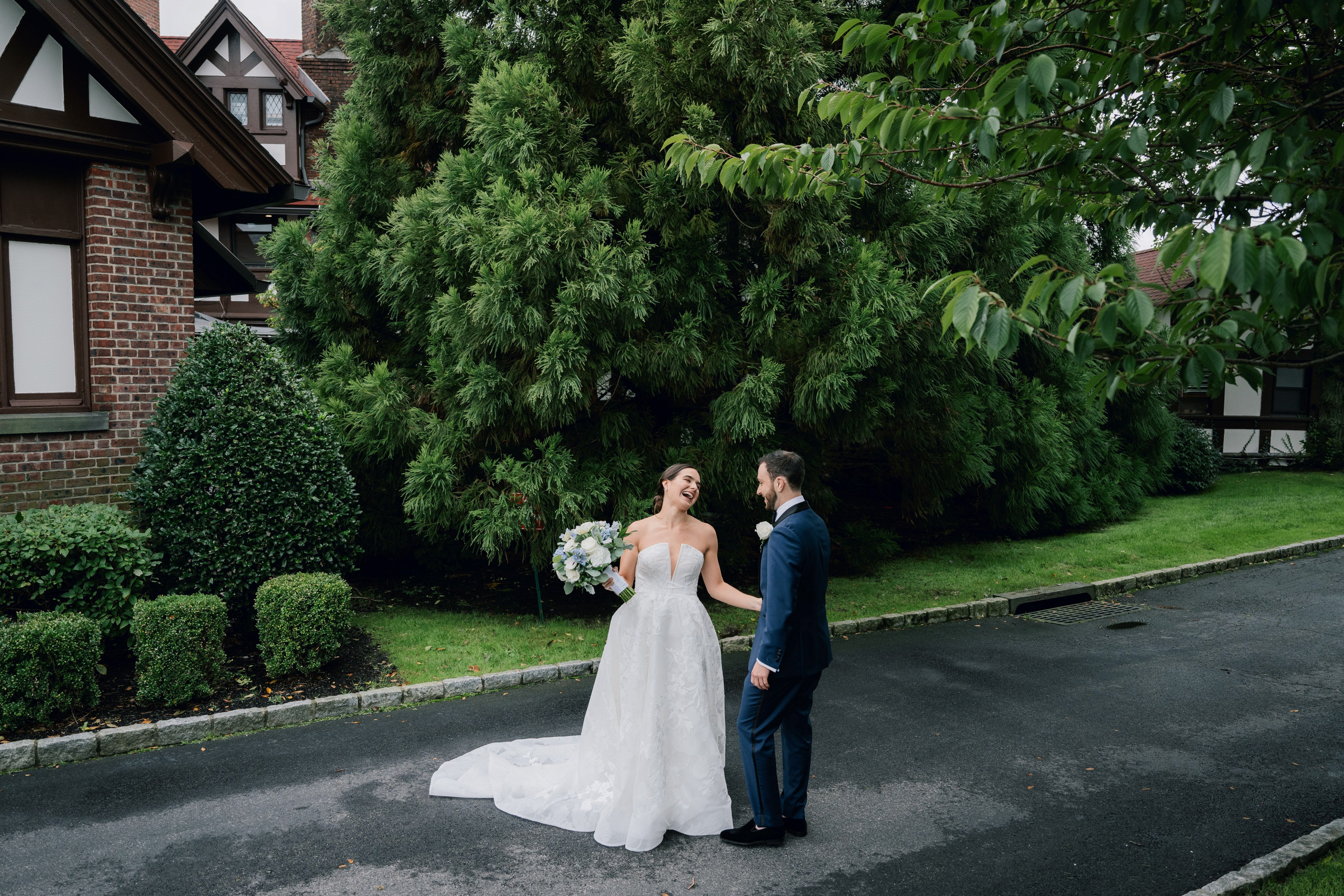 a bride and groom walking down the street
