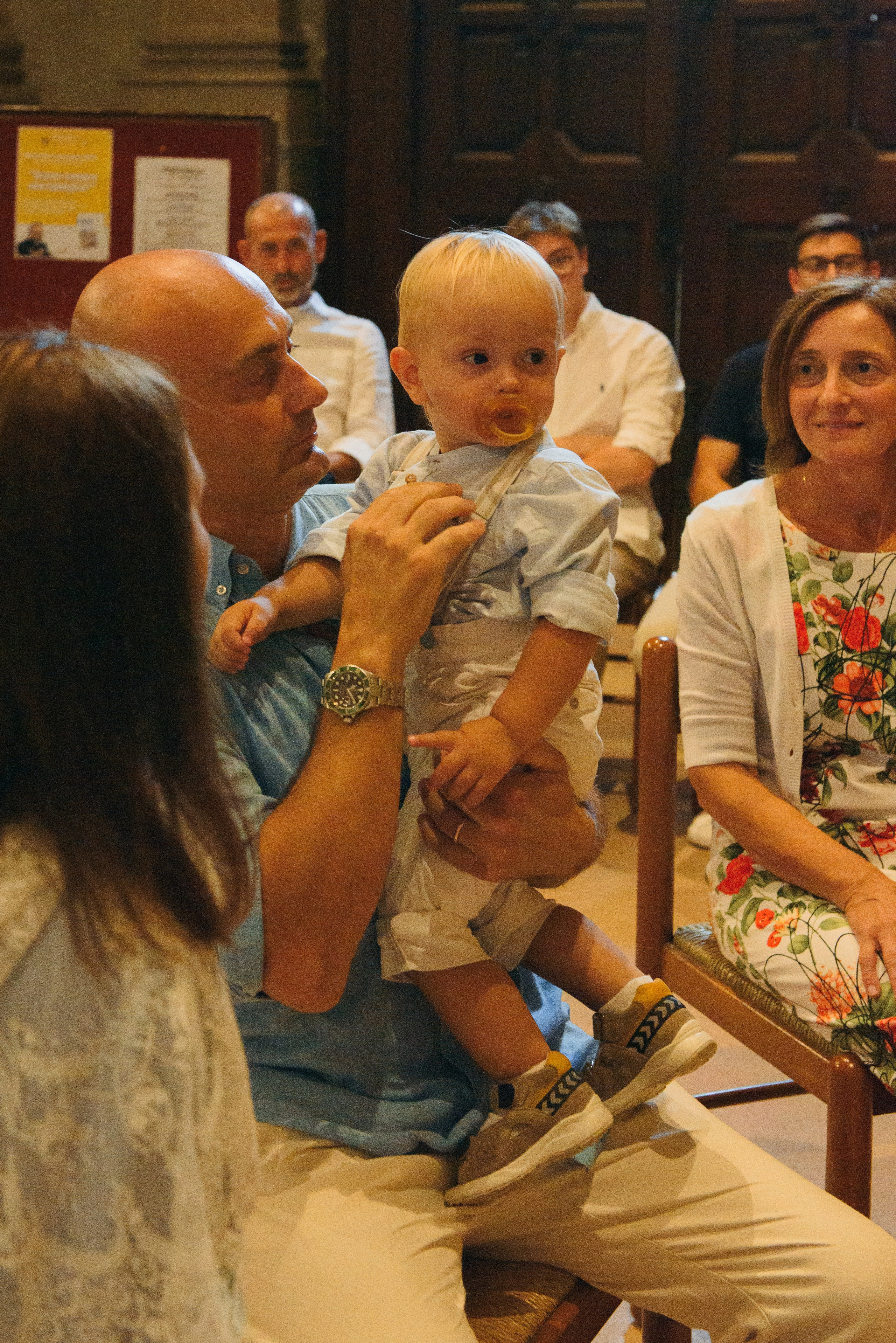 Family portaits during baptism in Milan capturing church